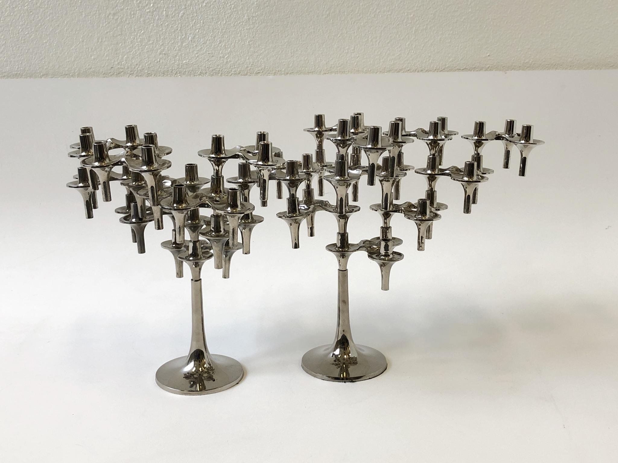 Collection of 21 German polish chrome sculptural stackable candleholders designed by Ceasar Stoffi for BMF Nagel in the 1960’s. 
The two bases have three that are attached and 15 are loose to arrange as desired. 

In original vintage condition
