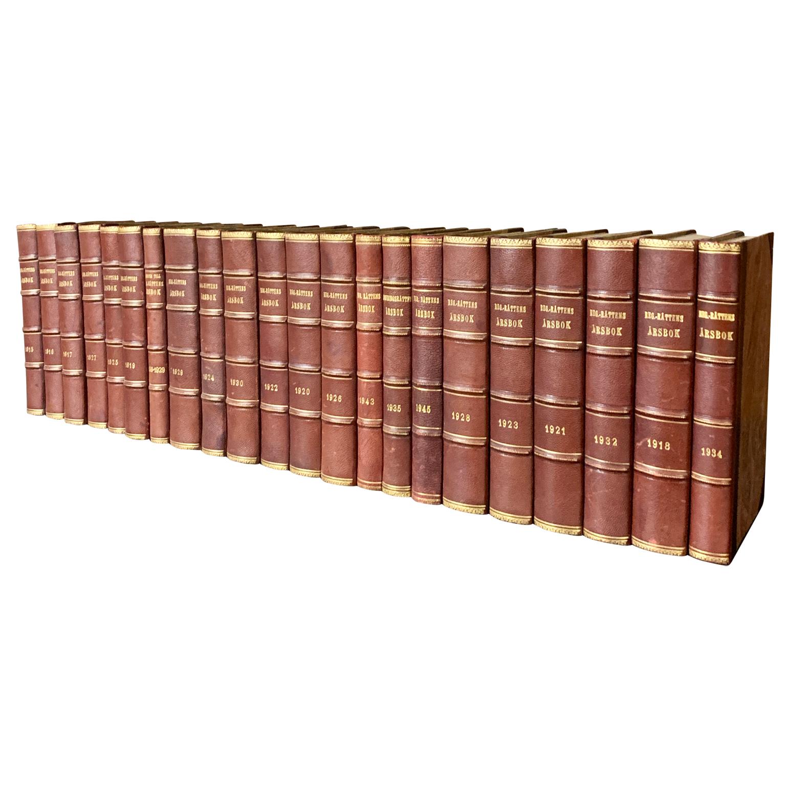 A collection of 22 Swedish decorative antique leather-bound library books.
The books are wrapped in leather-bound covers, comprised of a selection of warm tones and gold leaf print embossing.
The book collection measure horizontally is 80 cm,