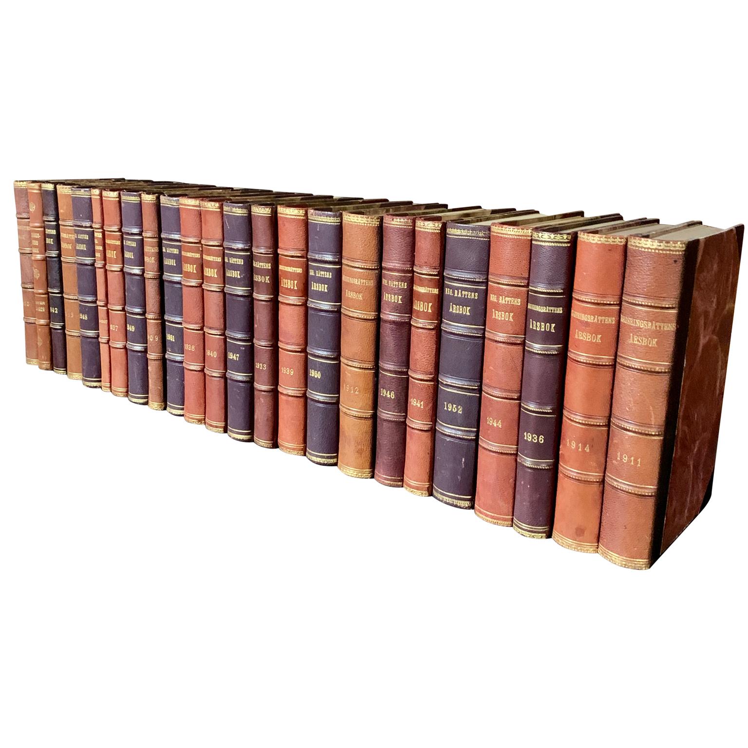 A collection of 24 Swedish decorative antique leather-bound library books.
The books are wrapped in leather-bound covers, comprised of a selection of warm tones and gold leaf print embossing.
The book collection measure horizontally is 79 cm,