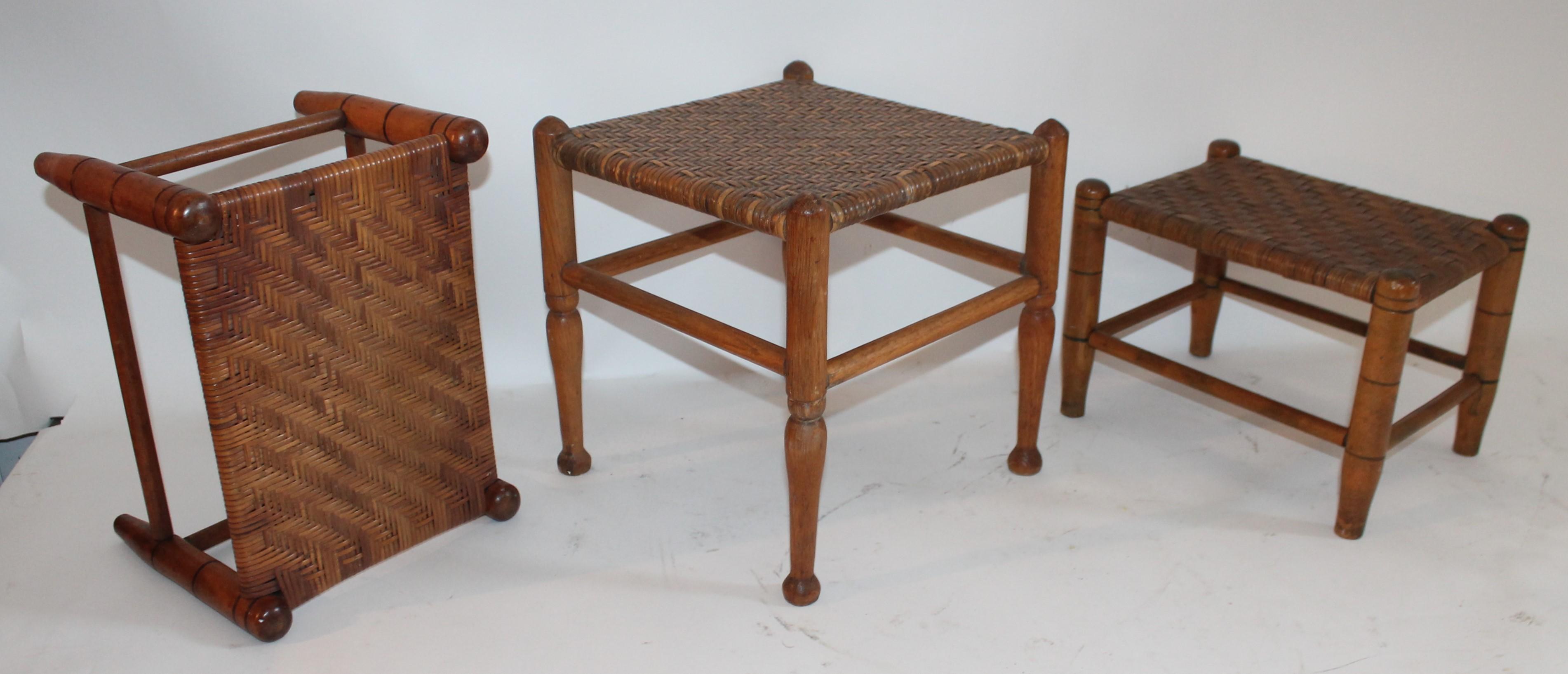 19th century collection of three foot stools with turned legs and hand woven seat. All stools are in fine condition.

Large foot stool measures 11.5 x 1.5 x 12
Both smaller foot stools measure 10 x 12 x 8.
