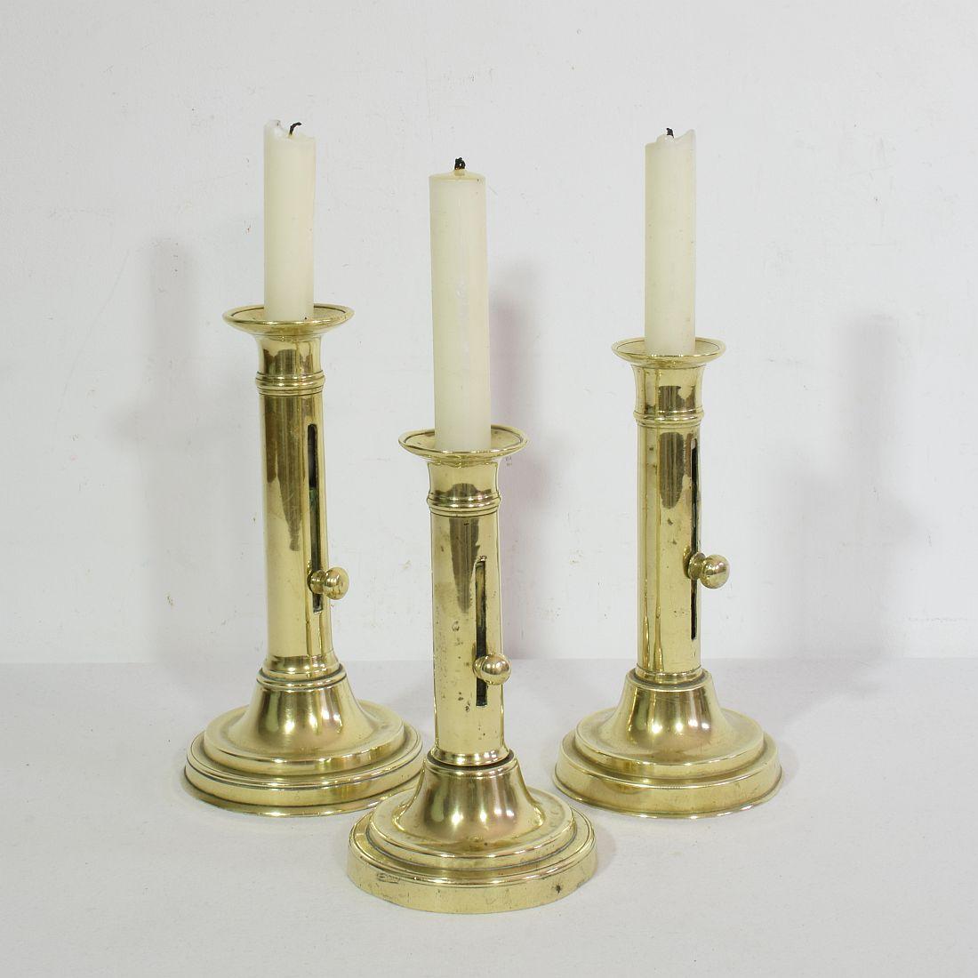 Wonderful collection of 3 brass push up bistro candleholders.
France circa 1850-1900
Measurements: H:17-20cm W:9,5-10,5cm.