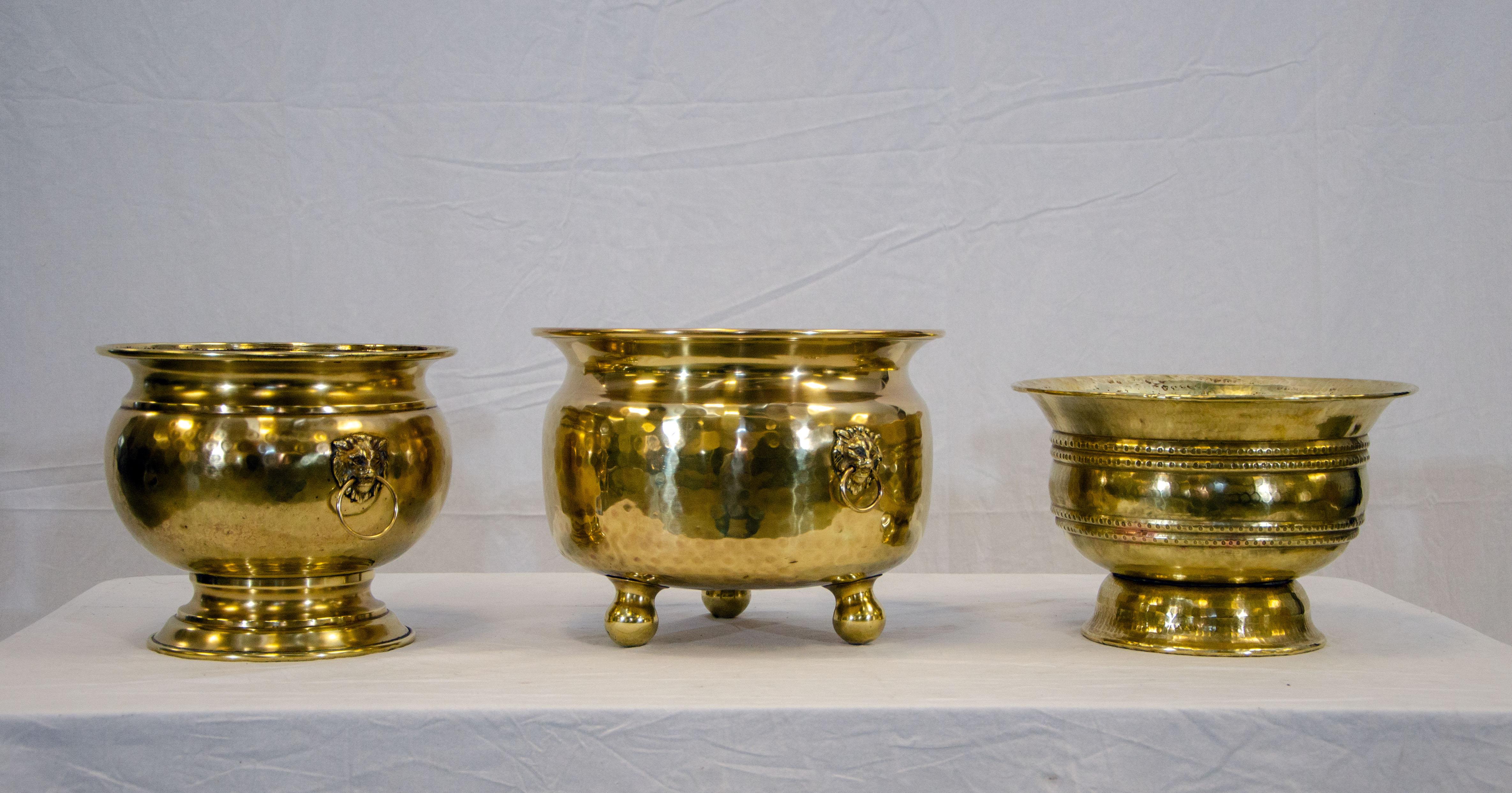 Nice collection of three brass jardinieres or cachepots to accent your decor. 
Measures: The largest sits on three 2