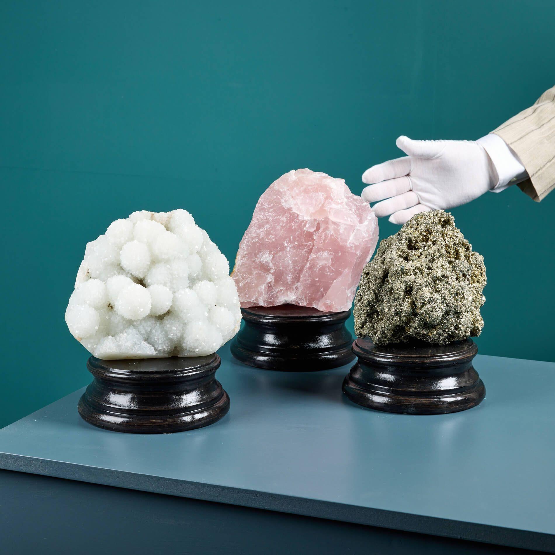 A collection of 3 large natural mineral specimens, each presented on an exclusive medium neoclassical style plaster plinth.

Each impressive cabinet specimen, including a Chalcedony, rose quartz, and pyrite, has its only striking form and finish