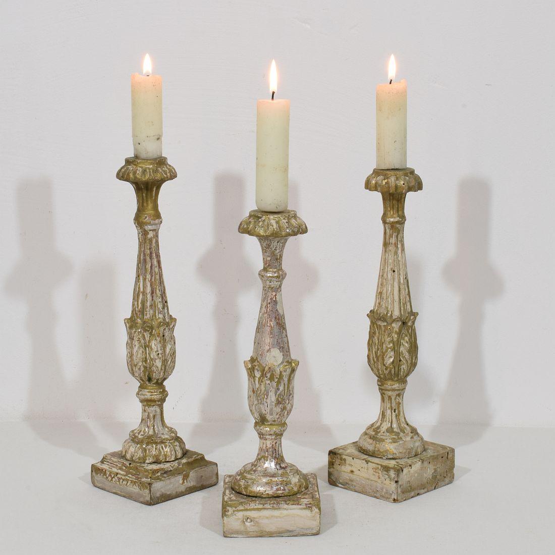 Lovely collection of 3  wooden candleholders with traces of their original silver and color.
Very nice type candleholder and rare to find in a group.
Italy, circa 1780-1800.
Weathered, small losses.
H:33-36cm  W:9cm