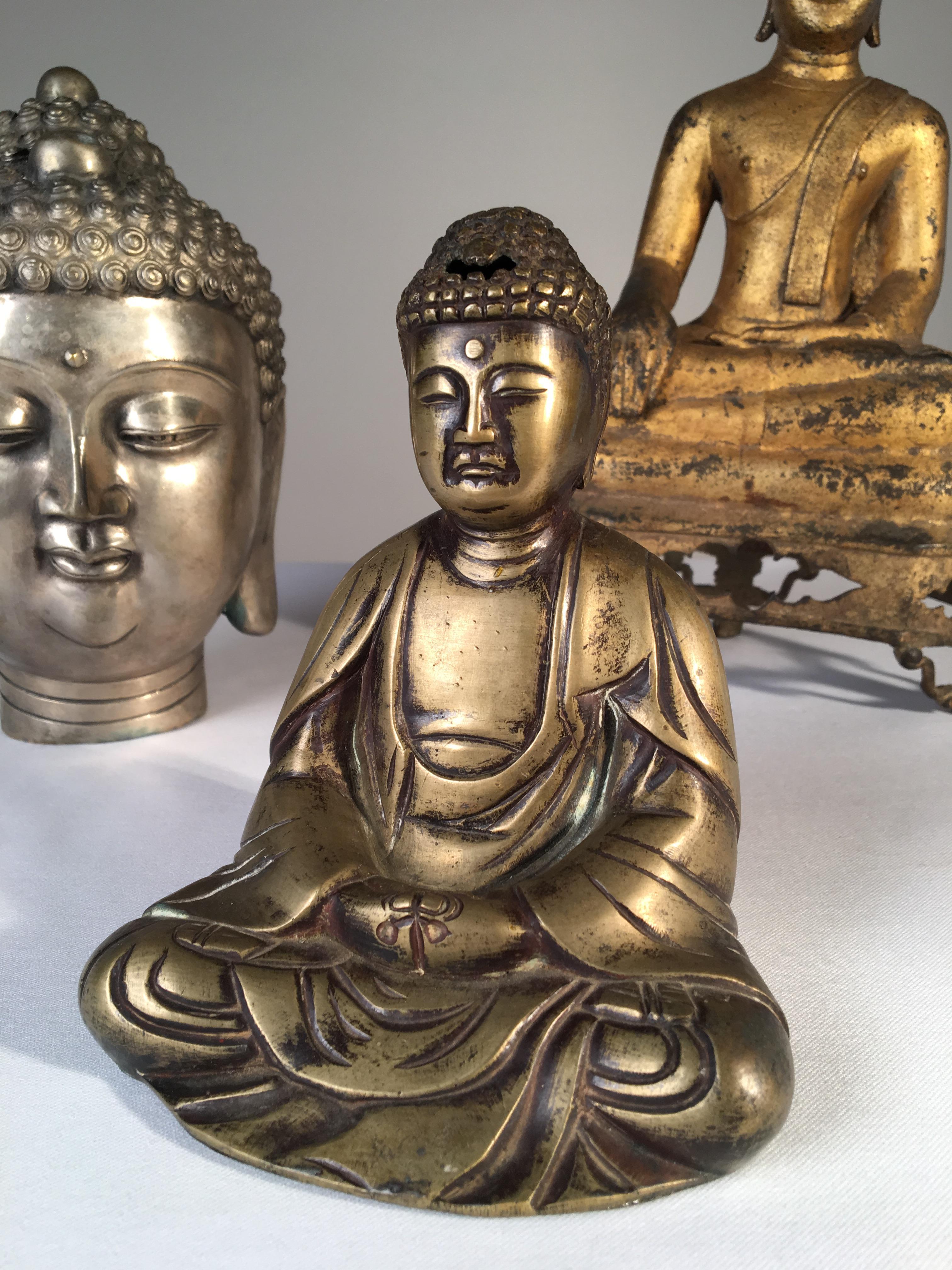A collection of 3 Buddhas in various metals, including an antique seated gilt bronze Thai Buddha.