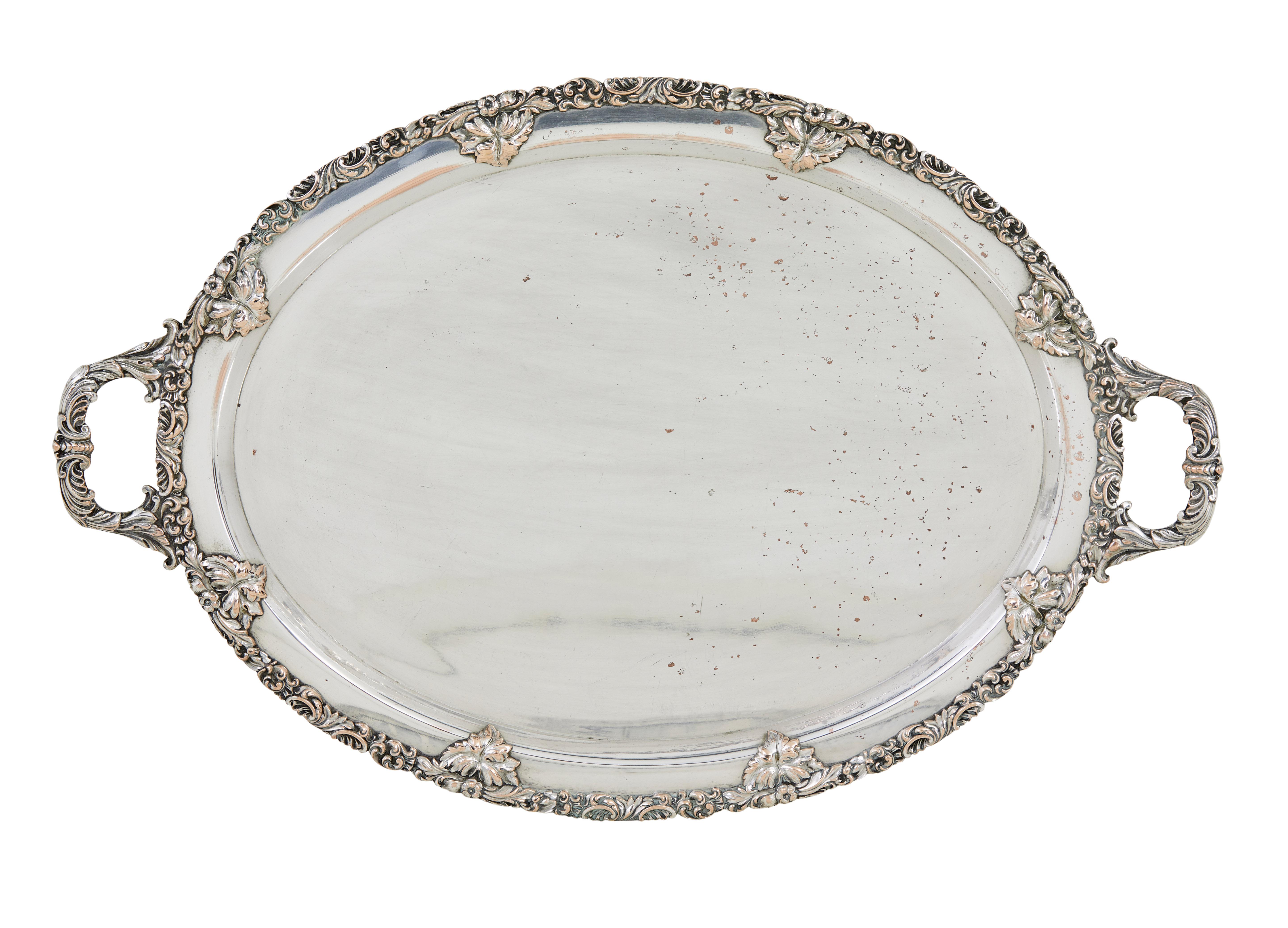 Collection of 3 silver plate ornate trays circa 1950.

3 ornate trays, oval shaped, scalloped edged and all with carrying handles. Smallest is stamped g.A.B sweden on the reverse

1 tray with plate loss and rubbing.