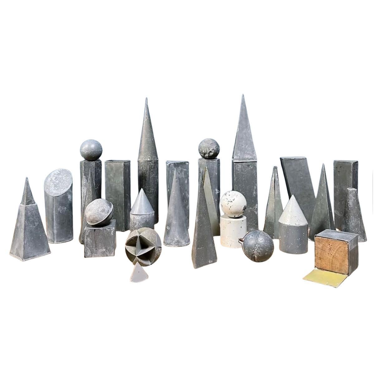 Collection of 33 old geometric zinc shapes For Sale