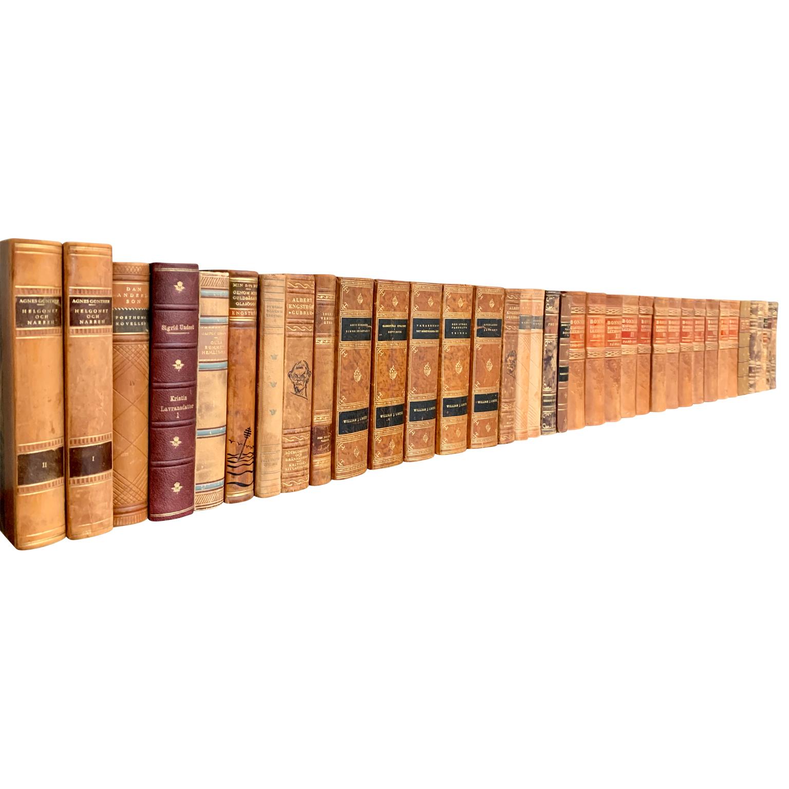 A collection of 38 Swedish decorative antique leather-bound library books

This lot of books on literature from Sweden are wrapped in beautiful vintage leather-bound covers, comprised of a selection of warm tones and gold leaf print embossing. The