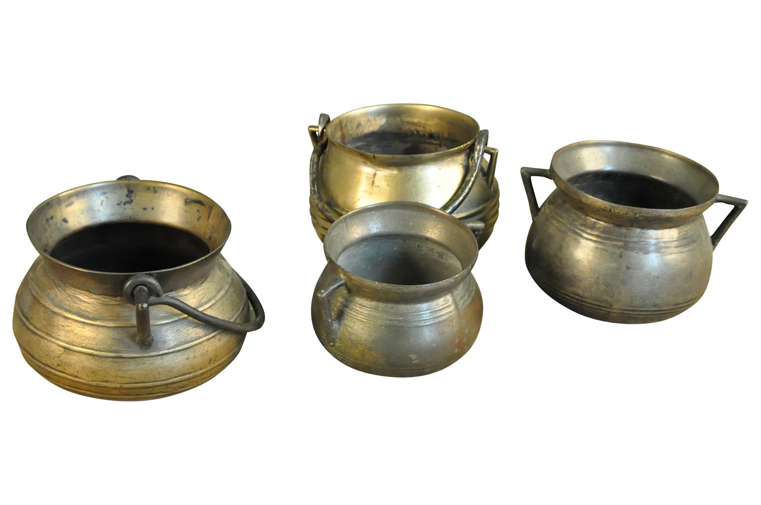 A wonderful collection of 18th century Olas - cooking pots from the Catalan region of Spain. Beautifully crafted from bronze. A stunning table top collection. The pieces range is size from the smallest Ola measuring 5 5/8