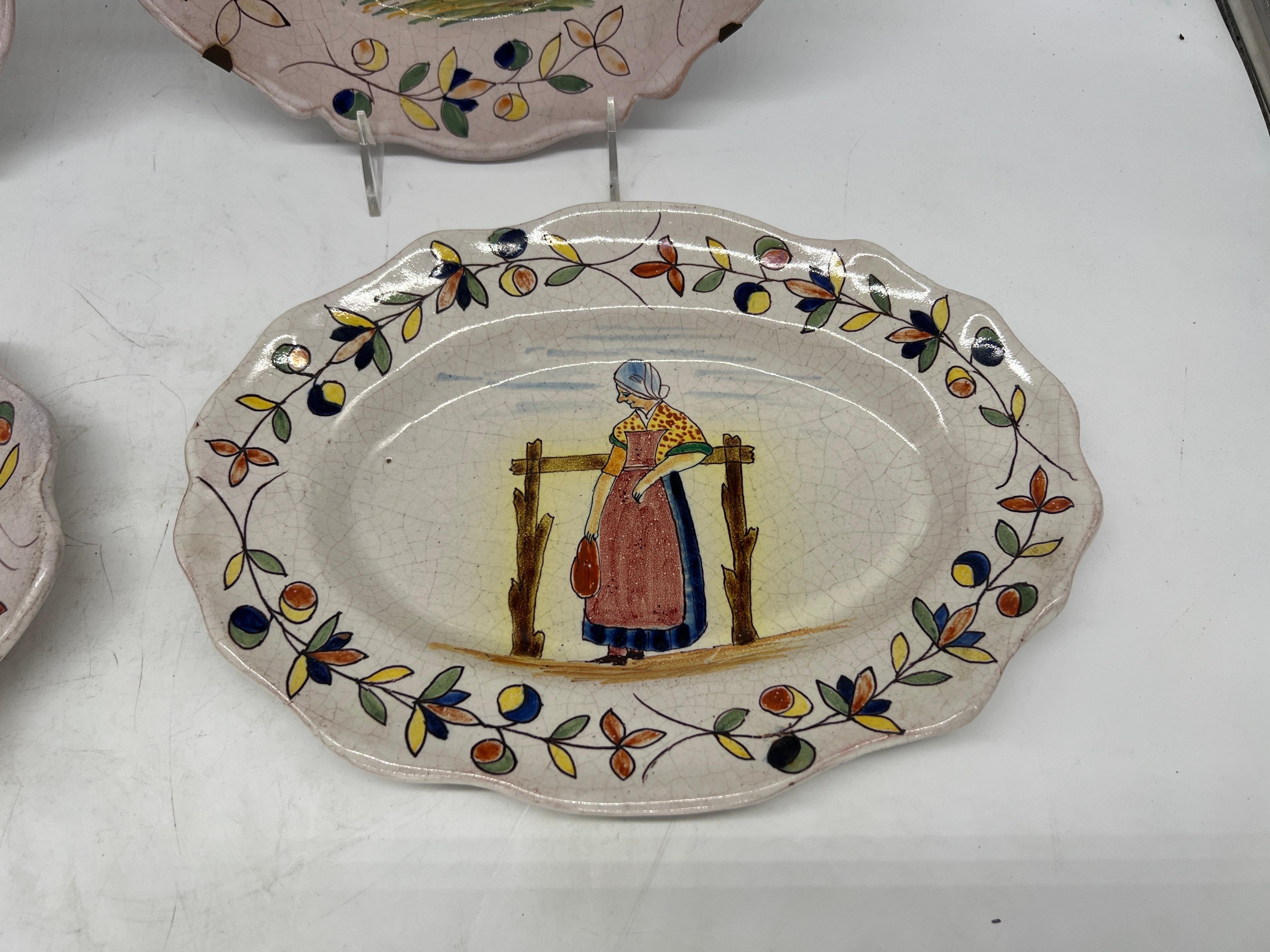 Collection of 4 French Quimper Faience Pottery Figural Plates  In Good Condition For Sale In Atlanta, GA