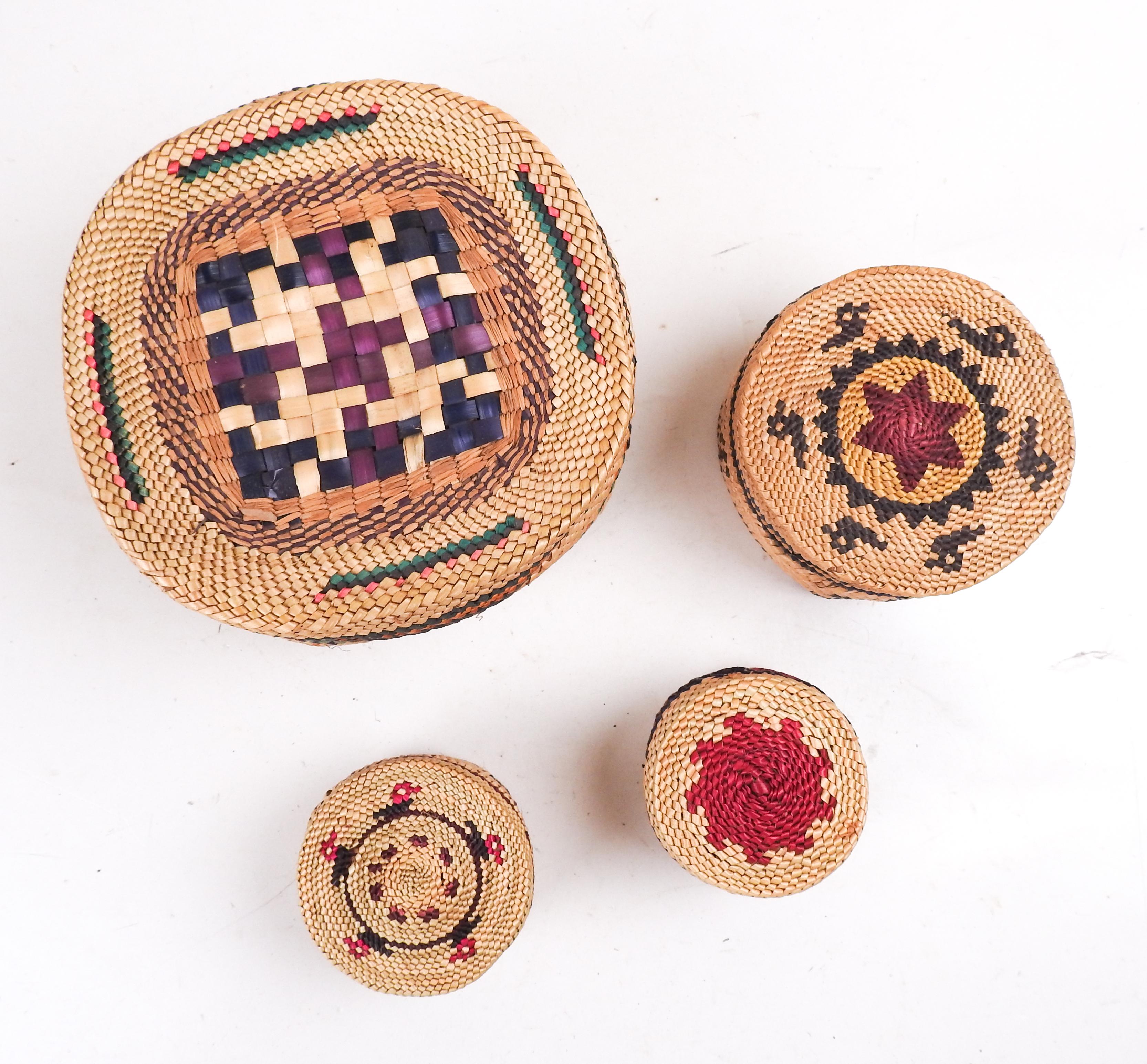 Collection of 4 Late 20th century hand woven Makah or Nuu-chah-nulth Indian Basket.  Ducks  and canoe on body and lid, various color banding.  The Nuu-chah-nulth inhabit the west coast of Vancouver Island, the Makah, are across the straight in