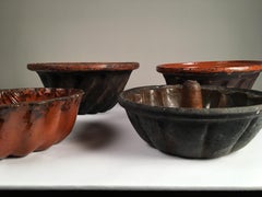Collection of 4 Pennsylvania Redware "Turk's Head" Cake Molds