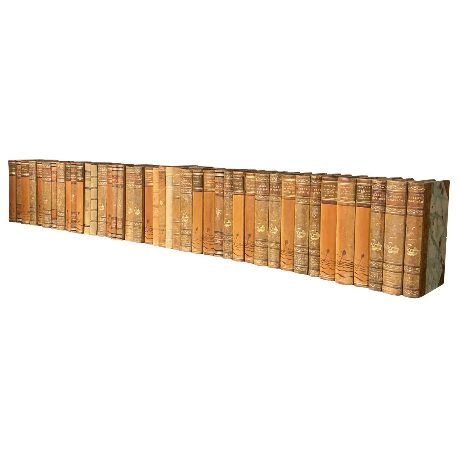 A collection of 47 Swedish decorative antique leather-bound library books from the from the 1930s-1940s.
The books are wrapped in leather-bound covers, comprised of a selection of warm tones and gold leaf print embossing.
The book collection