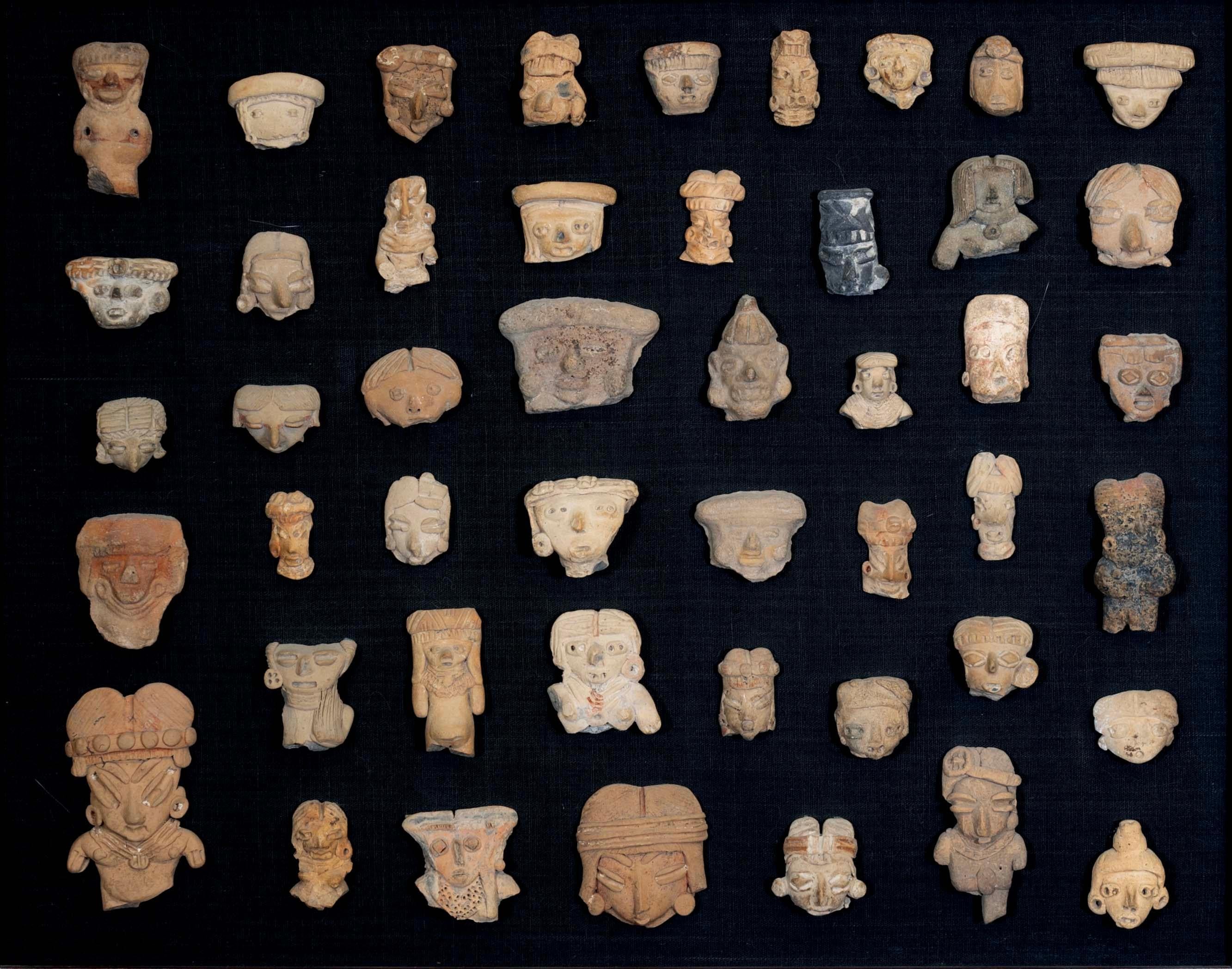 A monumental collection of 48 pre-Columbian hand-built pottery heads and bust artifacts. Possibly deriving from West Mexico, Michoacan or Chupicuaro. Although primitive, the carving is intricate with highly stylized details and characteristics. Each