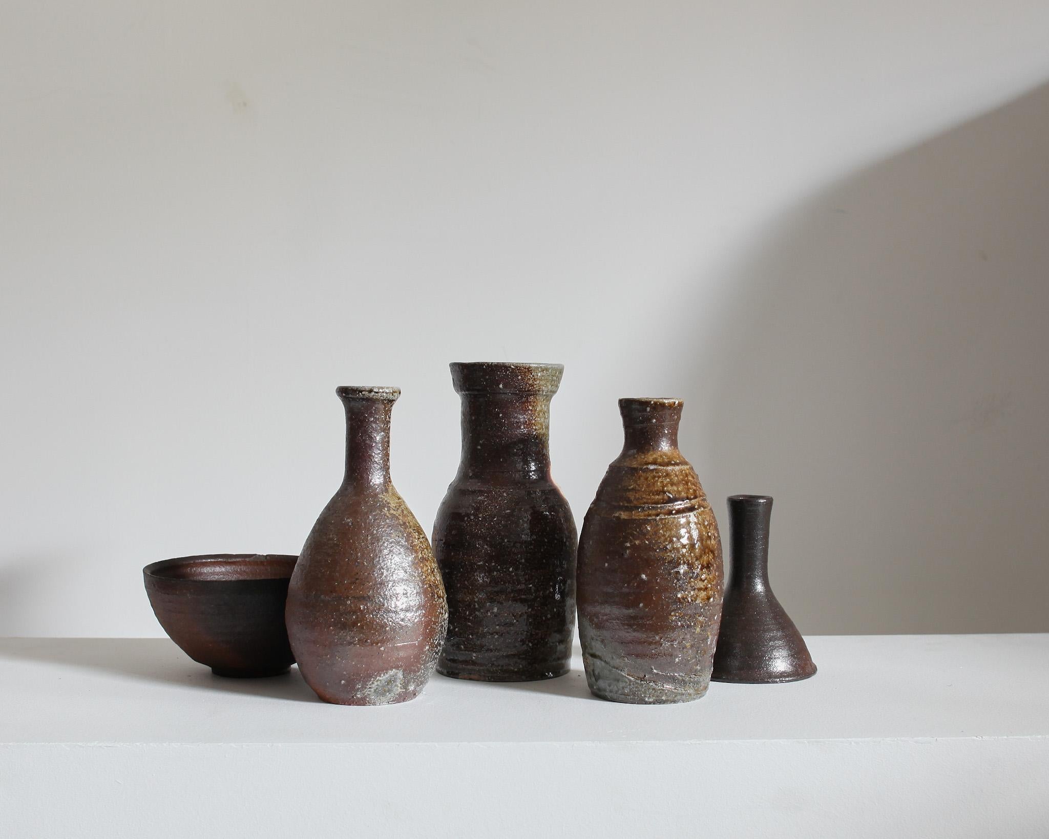 A collection of five unique stoneware/ceramic vessels from the famous pottery town of Mashiko, Japan.

Sourced from the former studio of a Mashiko lifetime potter.

These tactile vessels all display an earthy wabi-sabi aesthetic.

Most of the