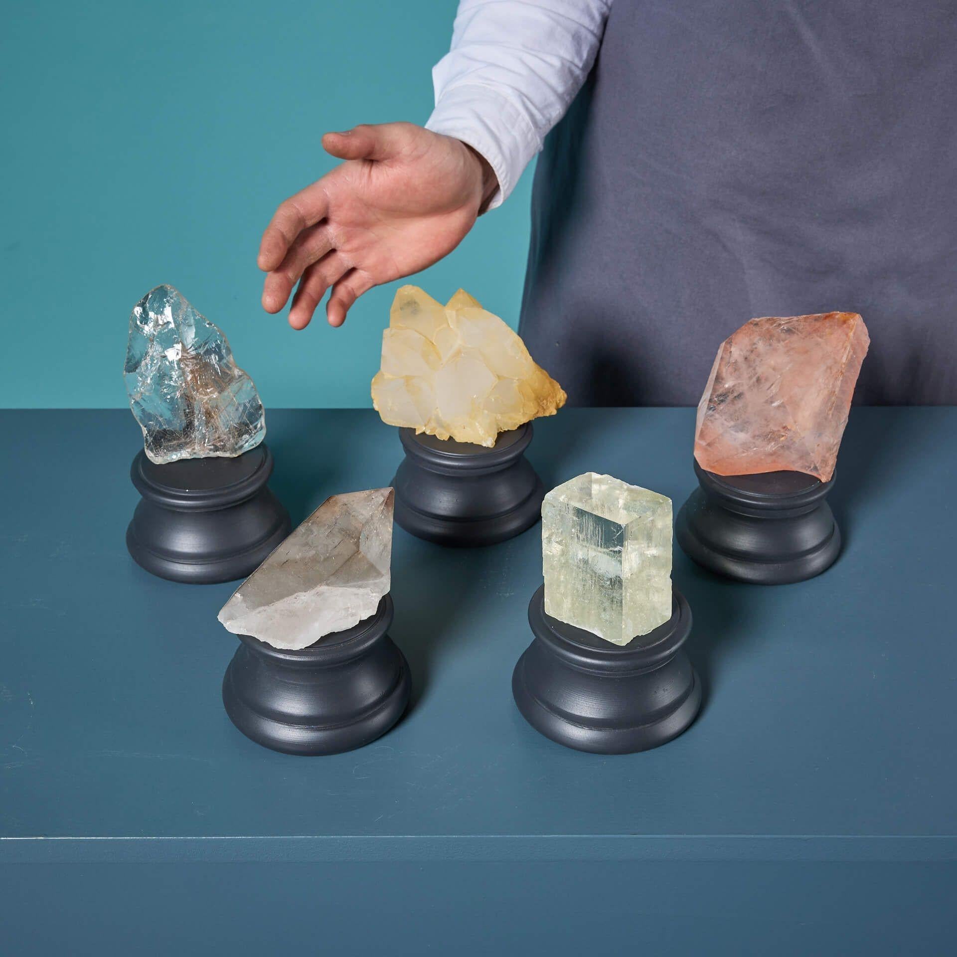 A varied collection of 5 natural mineral specimens, each presented on an exclusive small display base.

Highlights from this group of cabinet specimens include a pink quartz sourced from Brazil, three further quartz specimens and a calcite