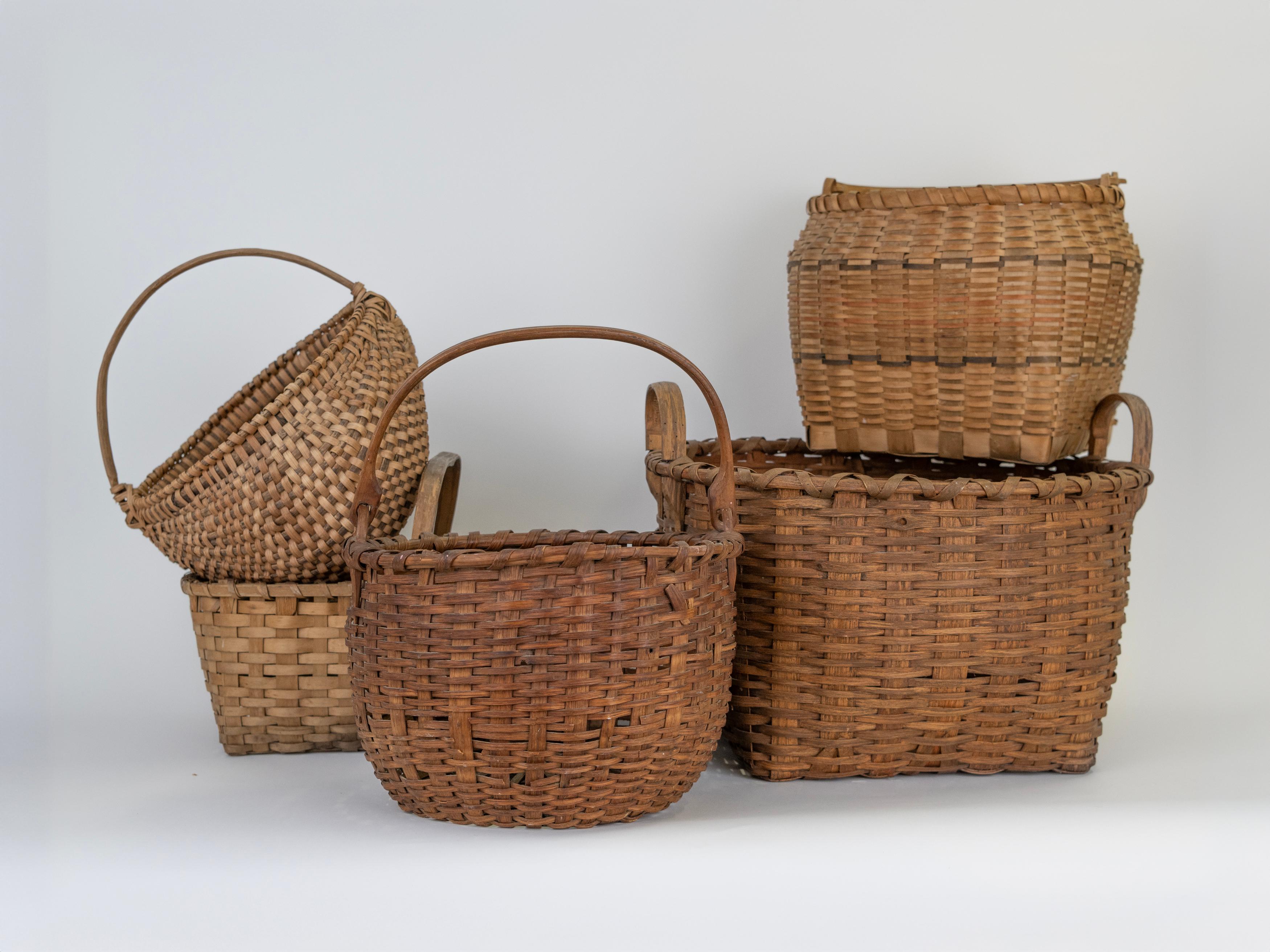 The Collection of baskets have been collected over time and share a style of weaving and estimated age. Woven in the Early America style and in excellent vintage condition the baskets make a beautiful and textural statement. 

Would be lovely styled