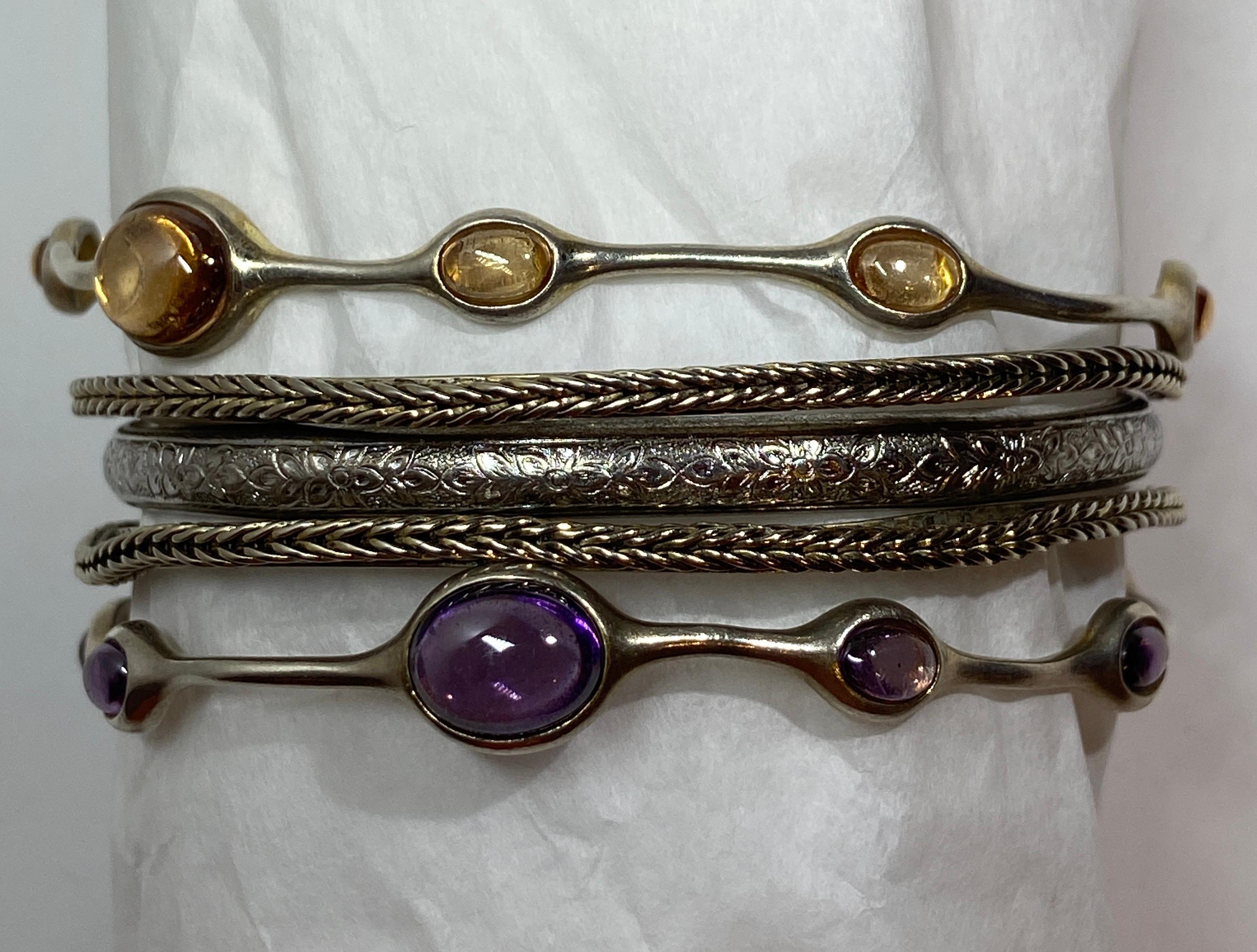 This wonderful collection of five assortment of sterling silver bracelet consist of one set with Amethyst stones with maker's mark along the interior 'FAS'. the partner bracelet is set with Citrine stones with maker's mark as well. The other pair of