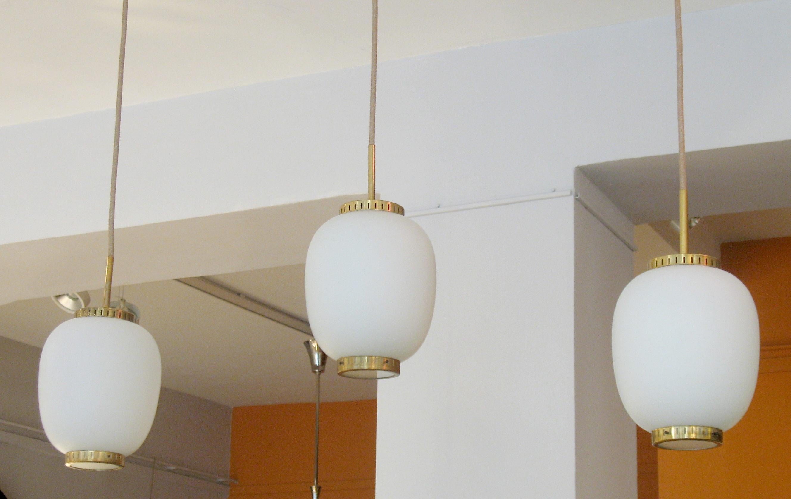 Collection of 5 small opaline glass and brass ceiling fixtures.
See dimensions below 
By Bent Karlby for Lyfa. 
Denmark, late 1950s.

Height of the opaline and brass disc)
H 9.4 in. (24 cm), D 7.8 in. (20 cm).