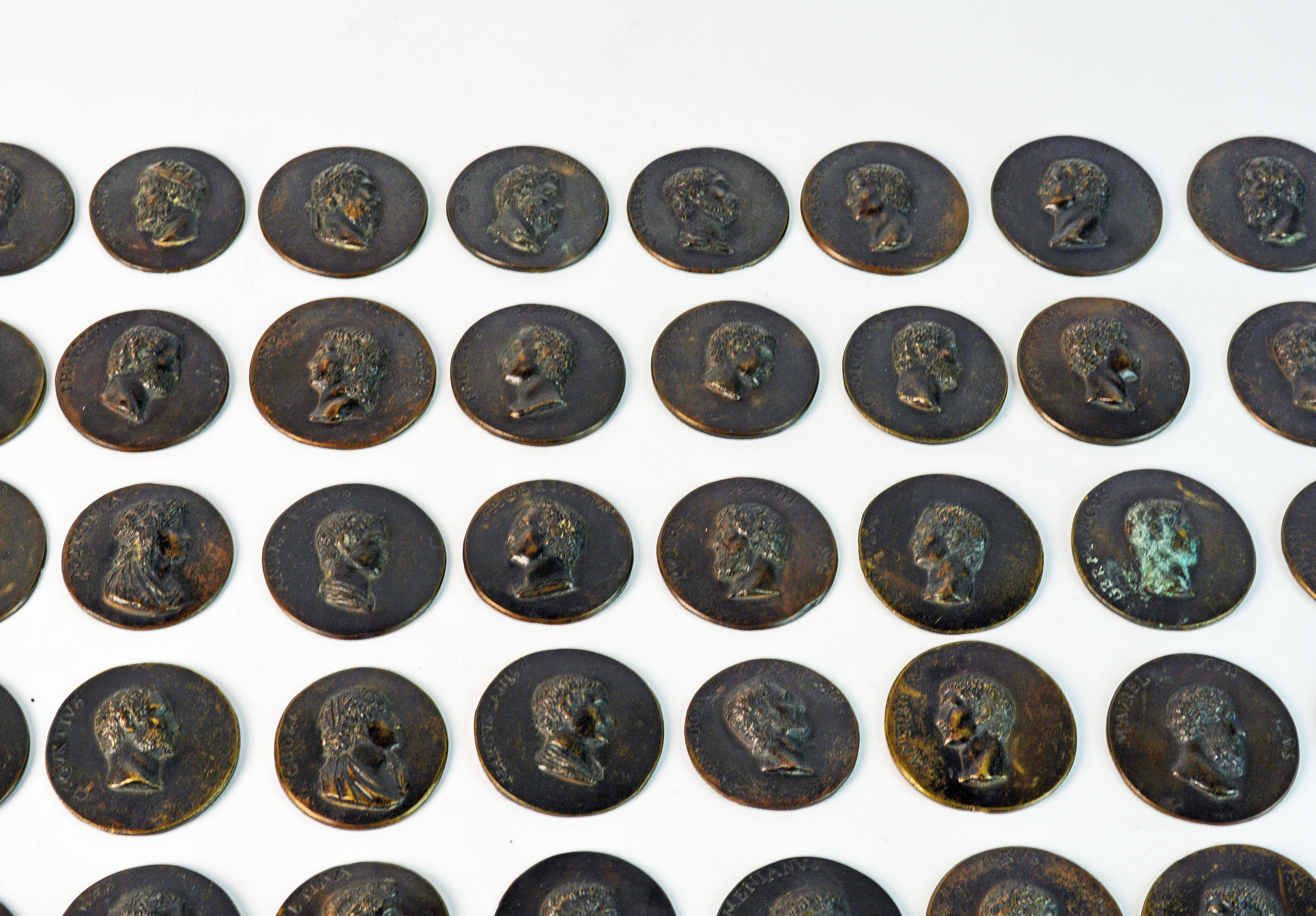 These likely Italian patinated bronze medallions depicts in high relief numerous Roman emperors, statesmen, deities and aristocratic citizens. Each is inscribed along the edge, all of them with name, many with a number in Roman numerals and again on