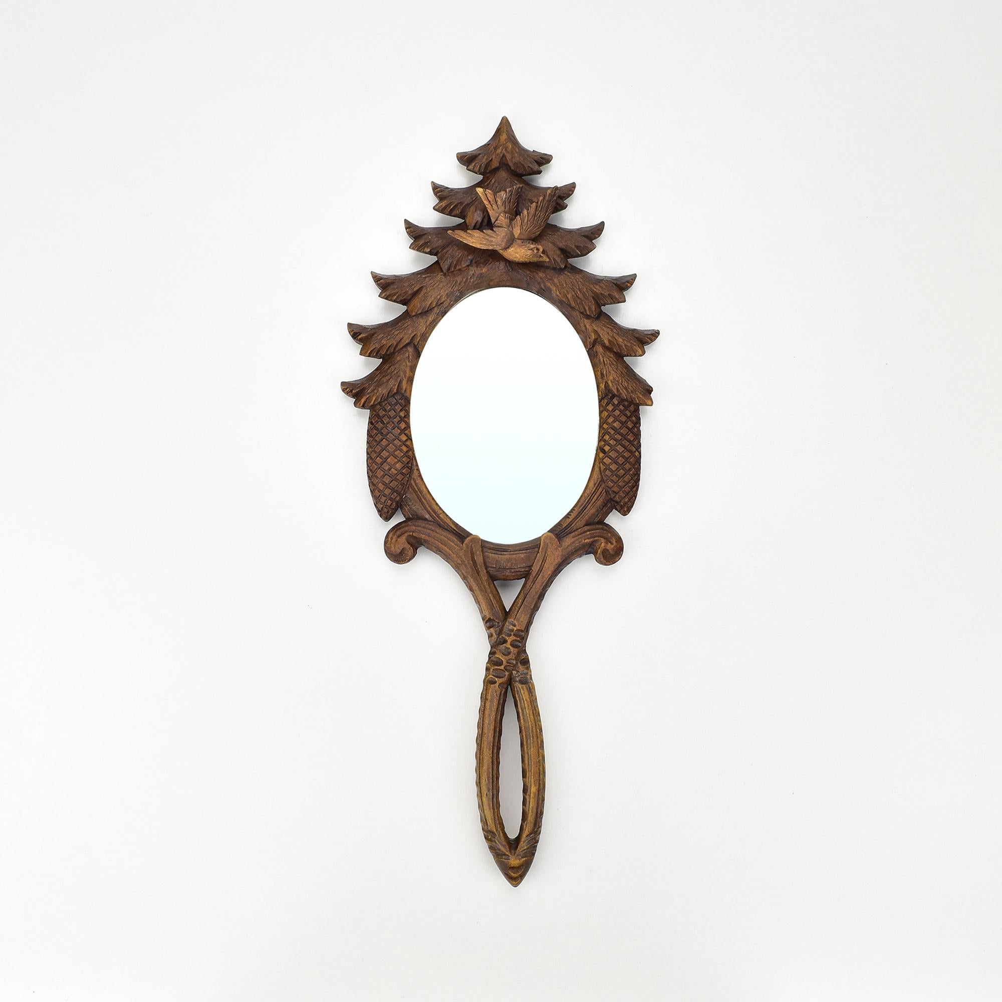 This stunning collection of six antique hand-carved wooden vanity mirrors showcases intricate craftsmanship from the Brienz Black Forest region. Each mirror features unique designs with natural motifs, including leaves, vines, and organic forms,