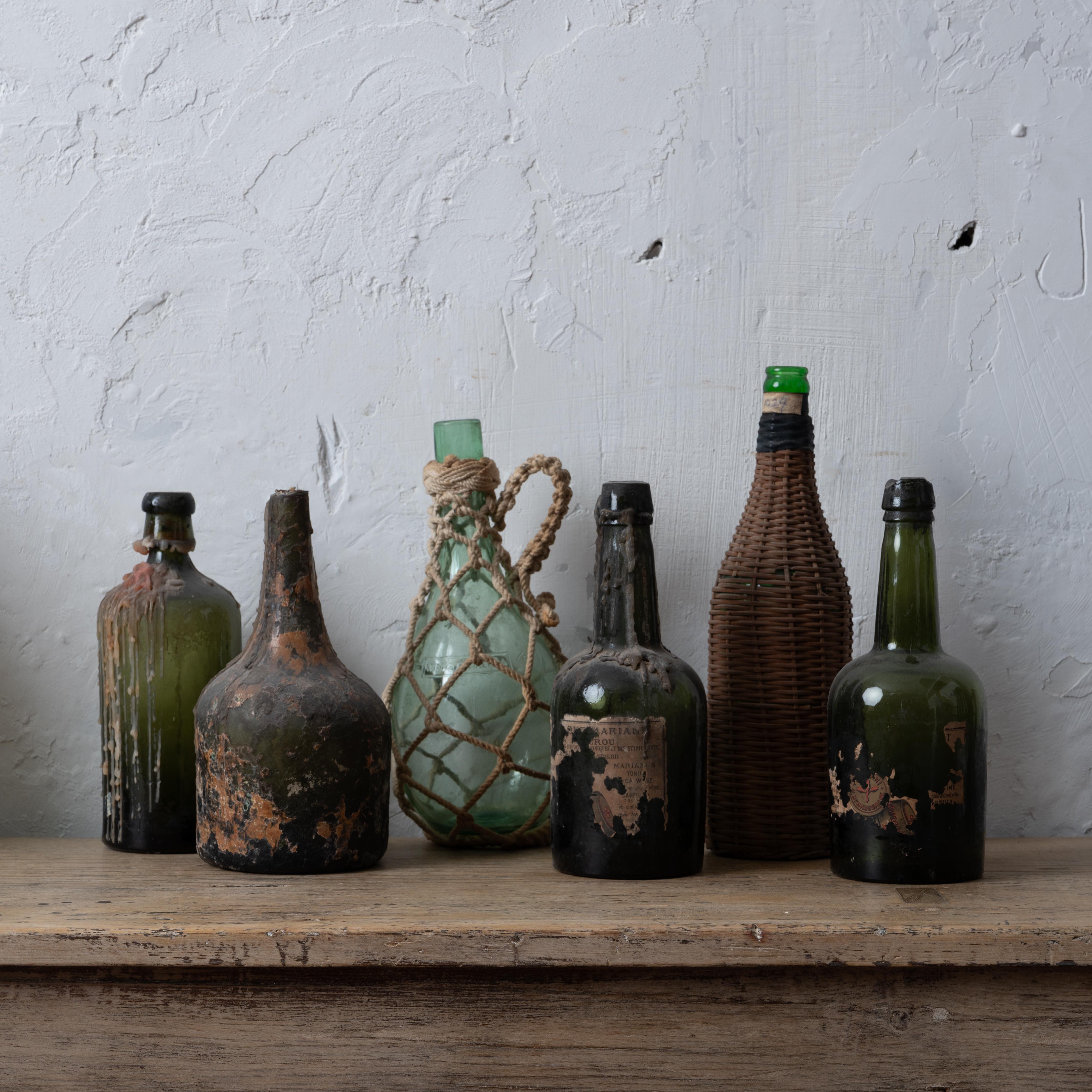 A collection of six antique wine bottles including a pair of Coca Mariani, woven wicker, etc, 19th-20th century.

Deaccessioned from the historic Owen-Thomas House cellar, Telfair Museums.



tallest: 12 inches

shortest: 8 ¾ inches



Fair