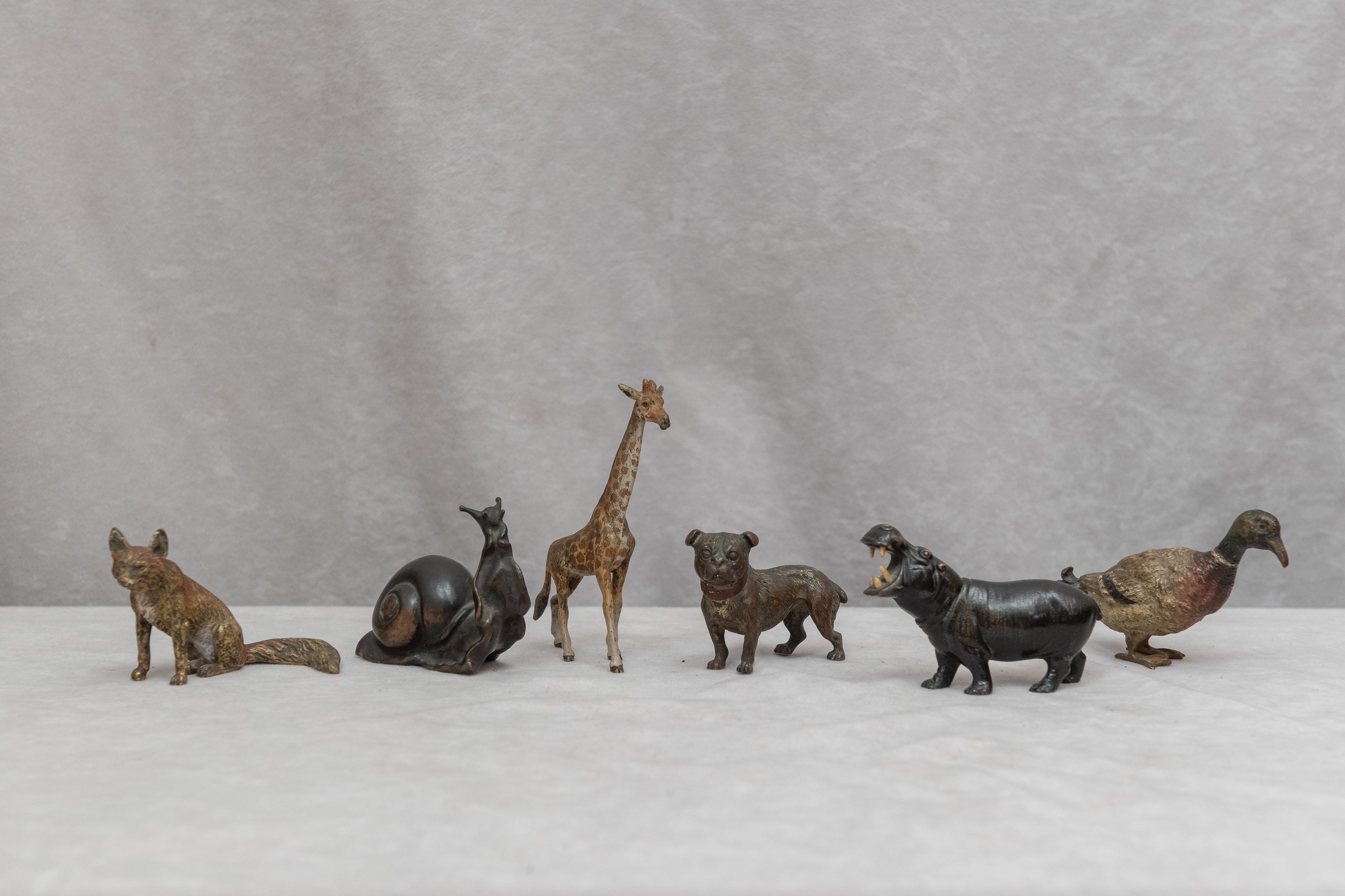 Offering a wonderful collection of Vienna bronze animals. All are cold painted except for the snail, which is still nicely patinated. There are several very unusual animals in this collection to include a giraffe and a hippo. The poor hippo is