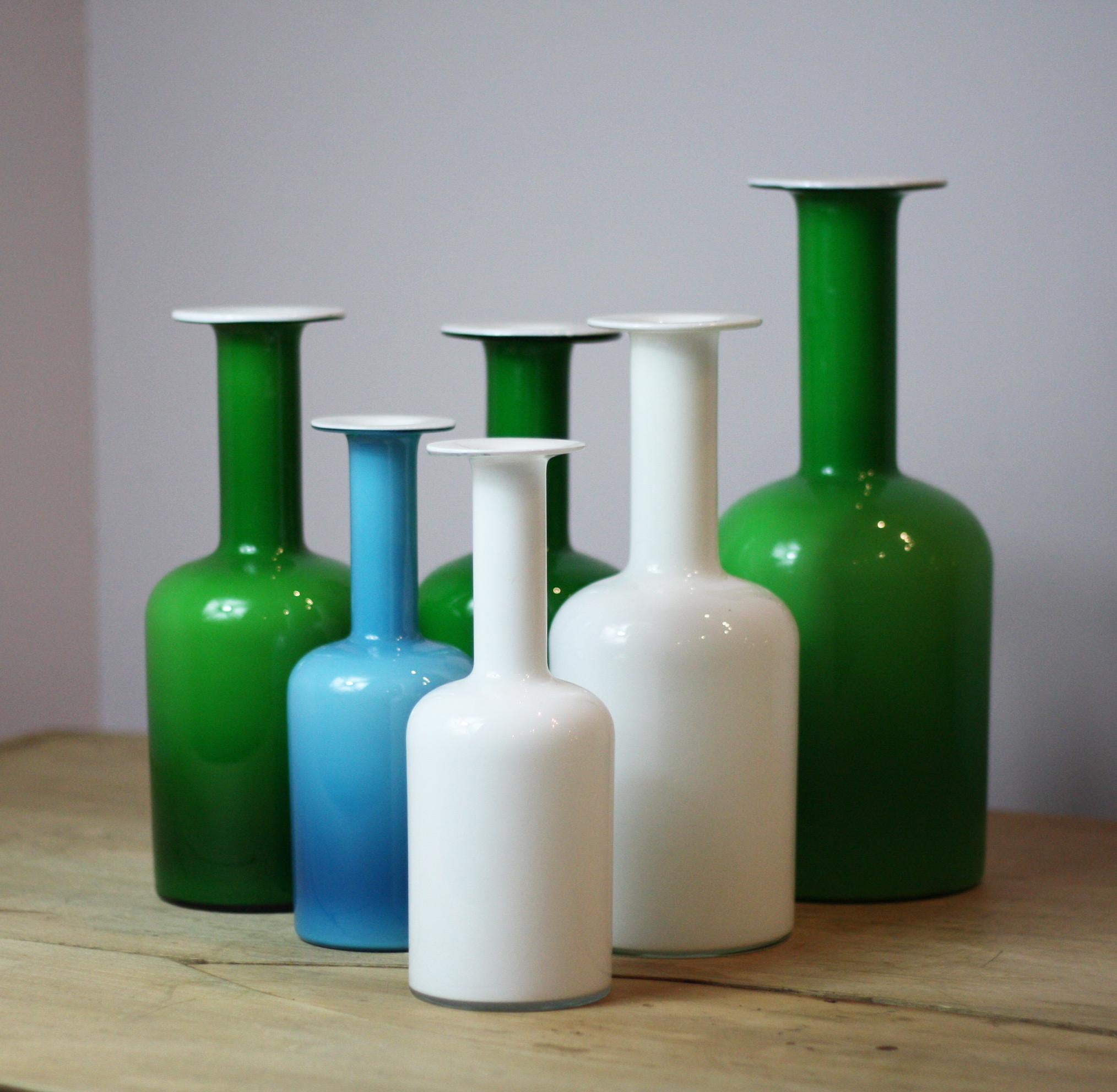 Collection of 6 Carnaby Gulvase Holmgaard vases 3 green 1 white 2 blue various sizes 2 with original stickers Danish, 1960s. Measurements are for the tallest.
