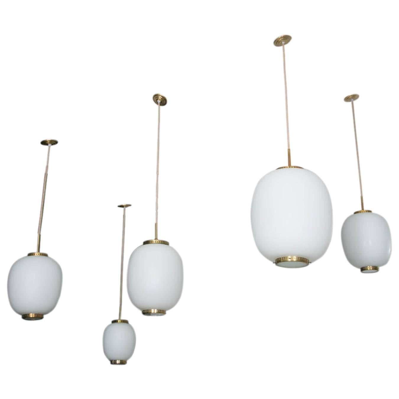 Collection of 9 opaline glass and brass ceiling fixtures.
See dimensions below
Designed by Bent Karlby for Lyfa.
Denmark, late 1950s.

Please note that this set of ceiling fixtures corresponds to the three items on the on last photo : Left ( Large