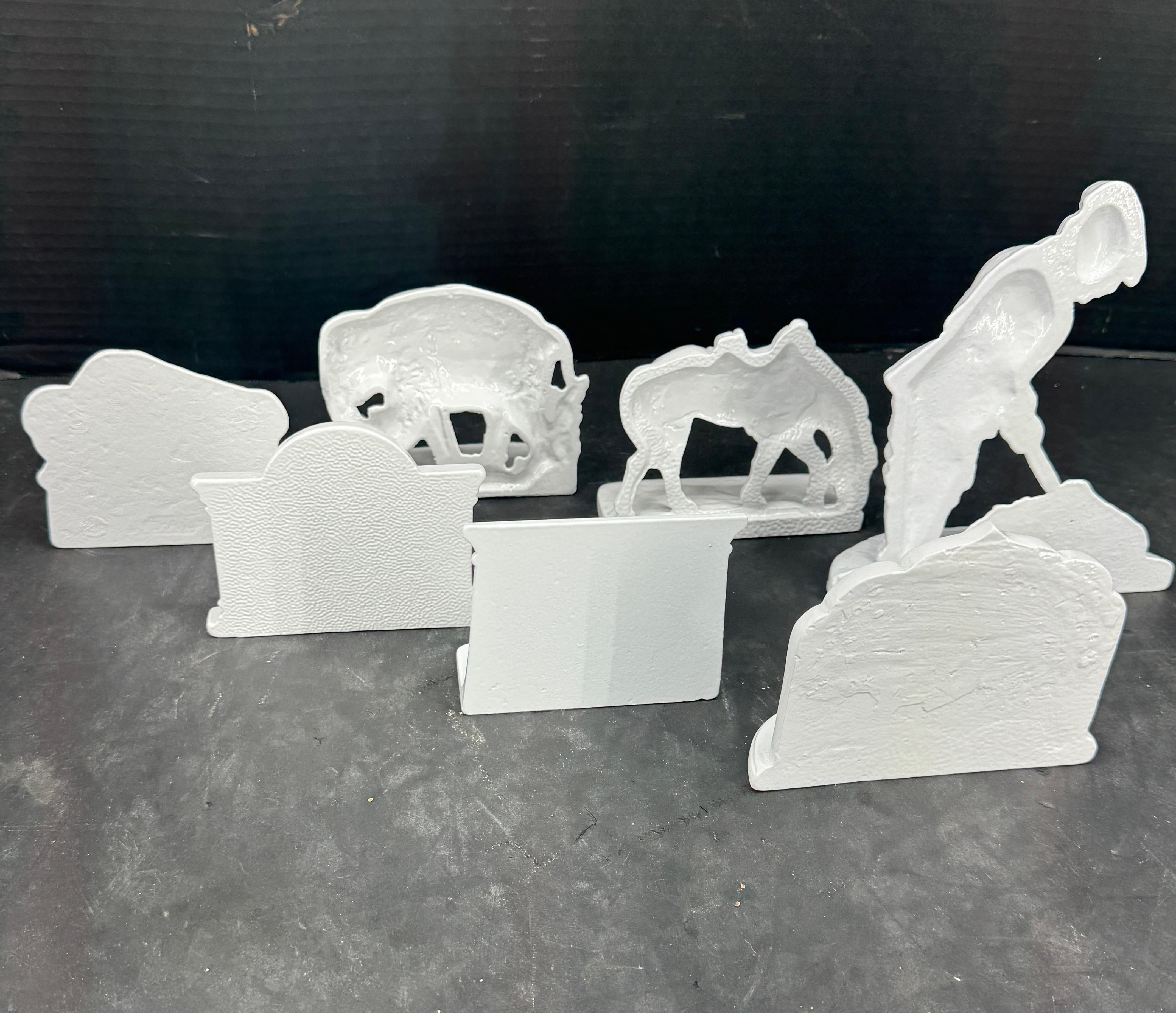 Collection of 7 White Powder Coated Cast Iron Bookends For Sale 4