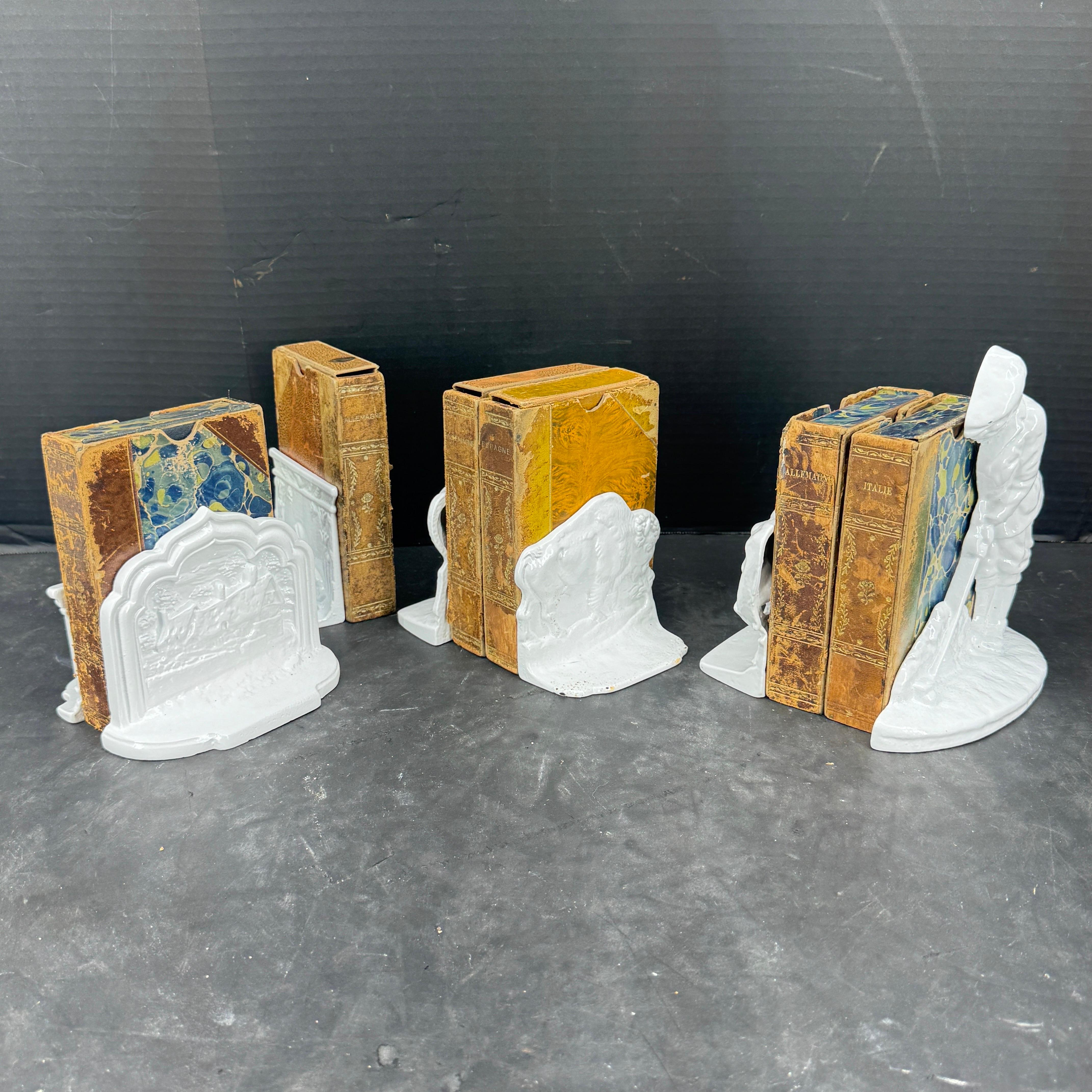 Classic set of 7 bookends, featuring a golfer, a horse, an elephant, a bull, a farmhouse, a sphinx and a monument. These handcrafted cast iron bookends would certainly accentuate your home on a bookcase, table, or desk. Would make a wonderful gift