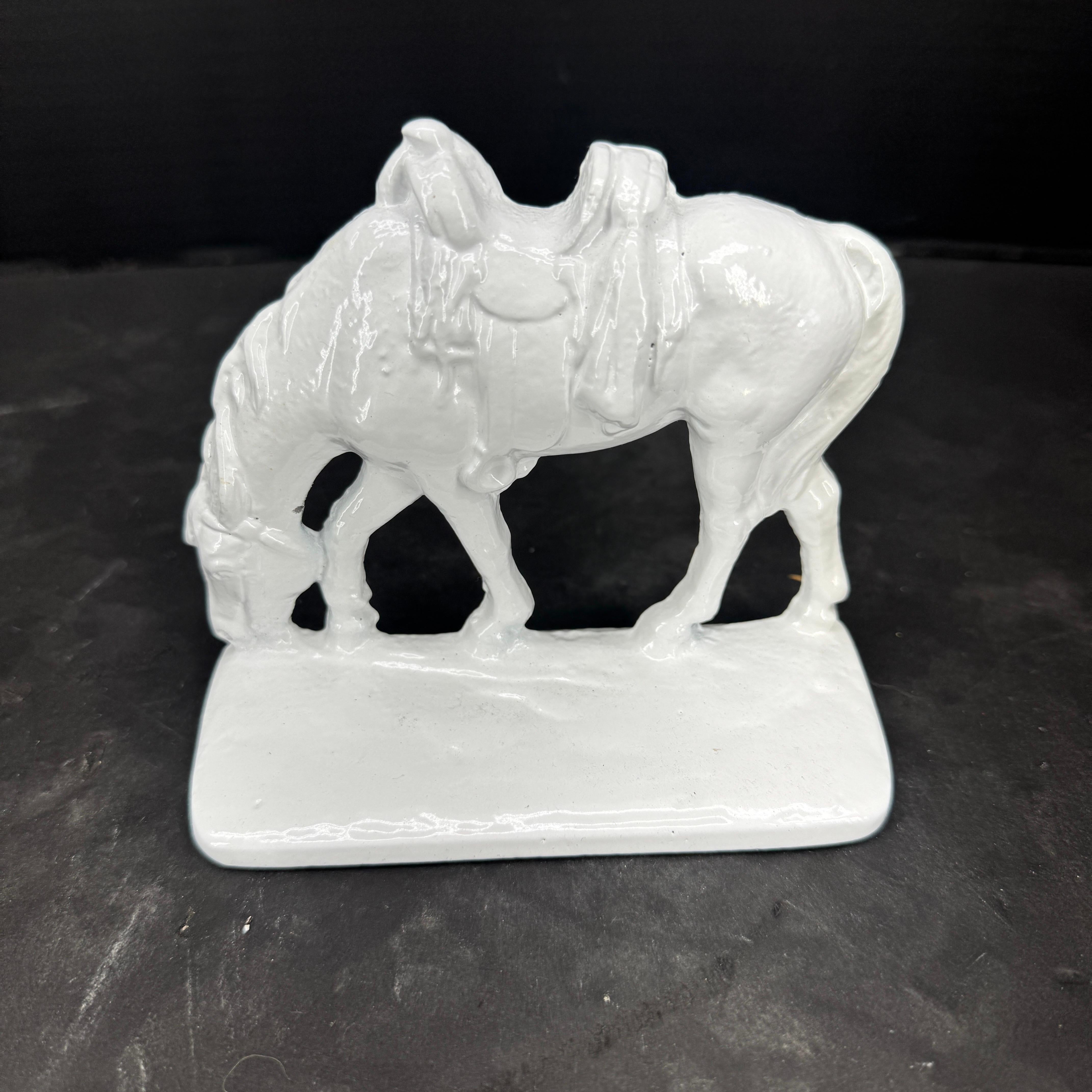 20th Century Collection of 7 White Powder Coated Cast Iron Bookends For Sale