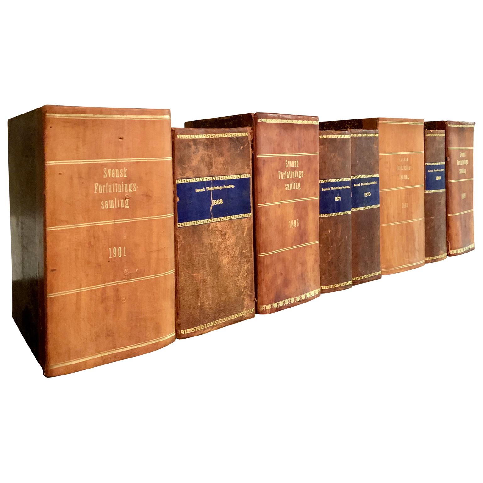 A collection of 8 Swedish decorative antique leather bound library books.

This lot of unusually large antique books from Sweden are wrapped in beautiful vintage leather-bound covers, comprised of a selection of warm tones and gold leaf print