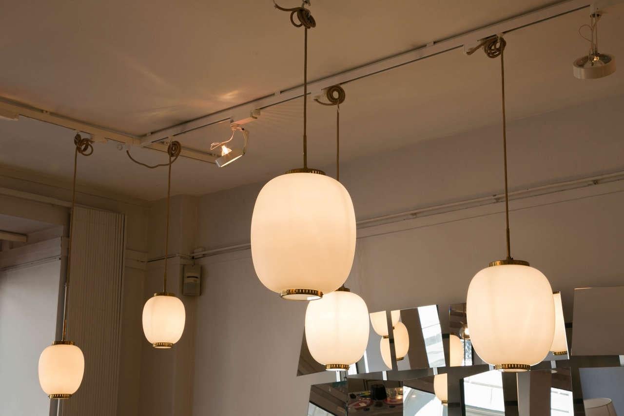 Mid-20th Century Collection of 8 Opaline Glass and Brass Ceiling Fixtures, Bent Karlby for Lyfa