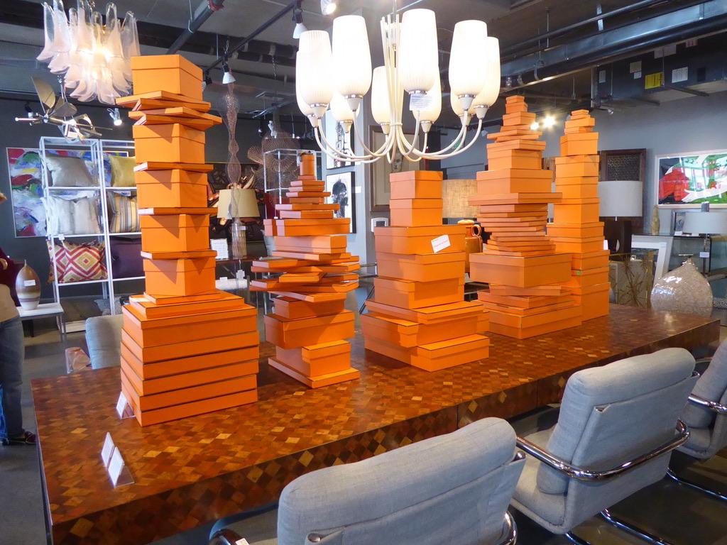 A wonderful collection of 88 vintage Hermes boxes of various sizes attached as stacked sculptures. The largest box measures 15