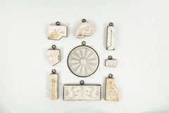 Collection of 9 Antique Architectural Plaster Fragments Framed in Iron