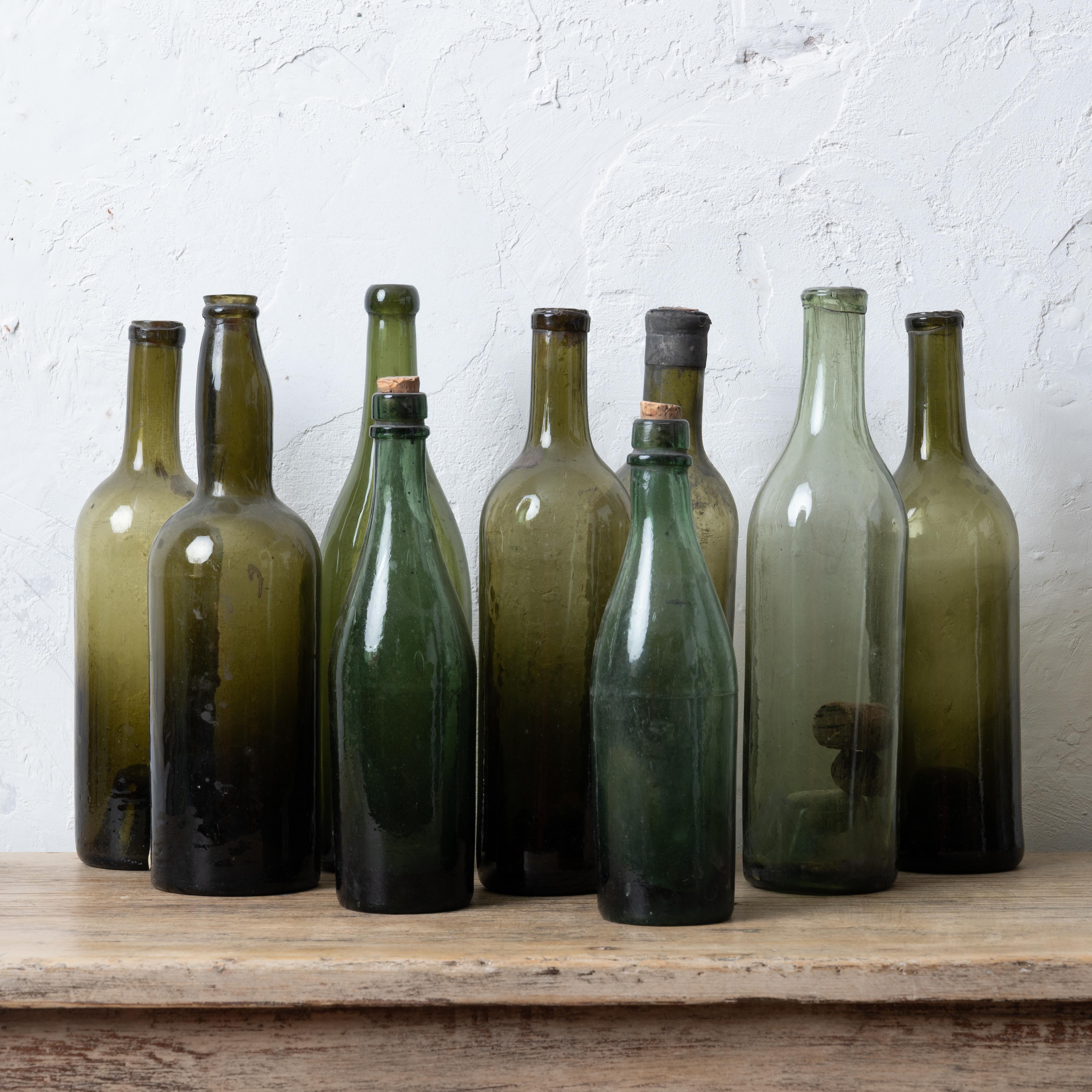 A collection of nine antique green wine bottles, 19th century.

C.H.C. & S on bottom of one.

Deaccessioned from the historic Owen-Thomas House cellar, Telfair Museums.



tallest: 11 ¾ inches

shortest: 9 ¼ inches tall



