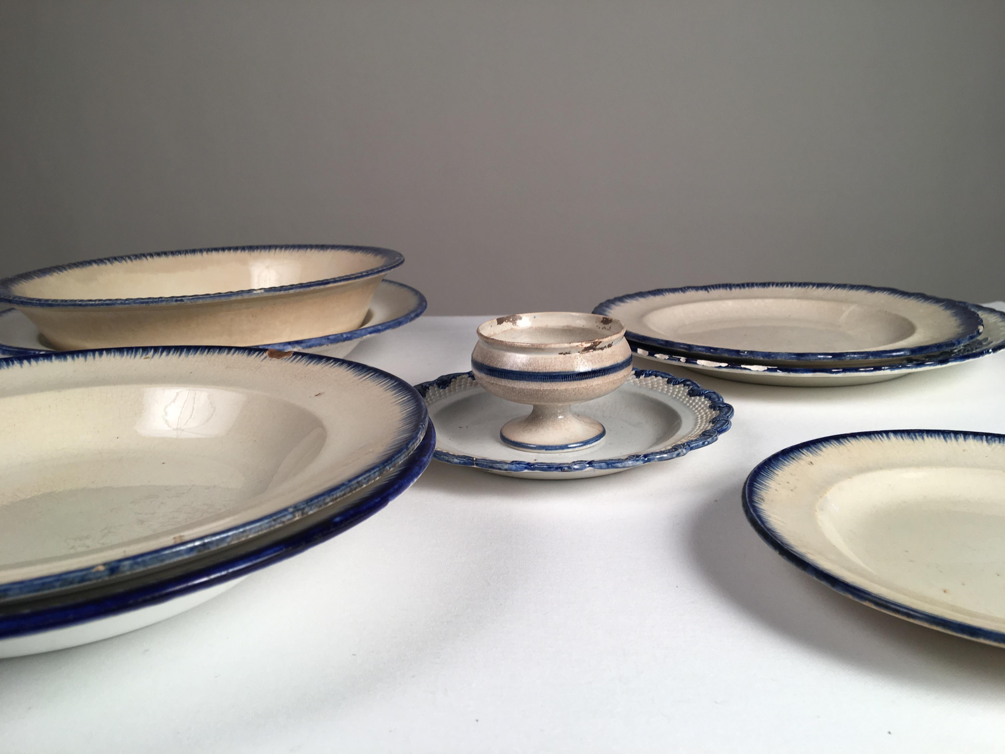 A collection of 9 Leeds and other makers blue and white feather ware plates and bowls, early 19th century, England.