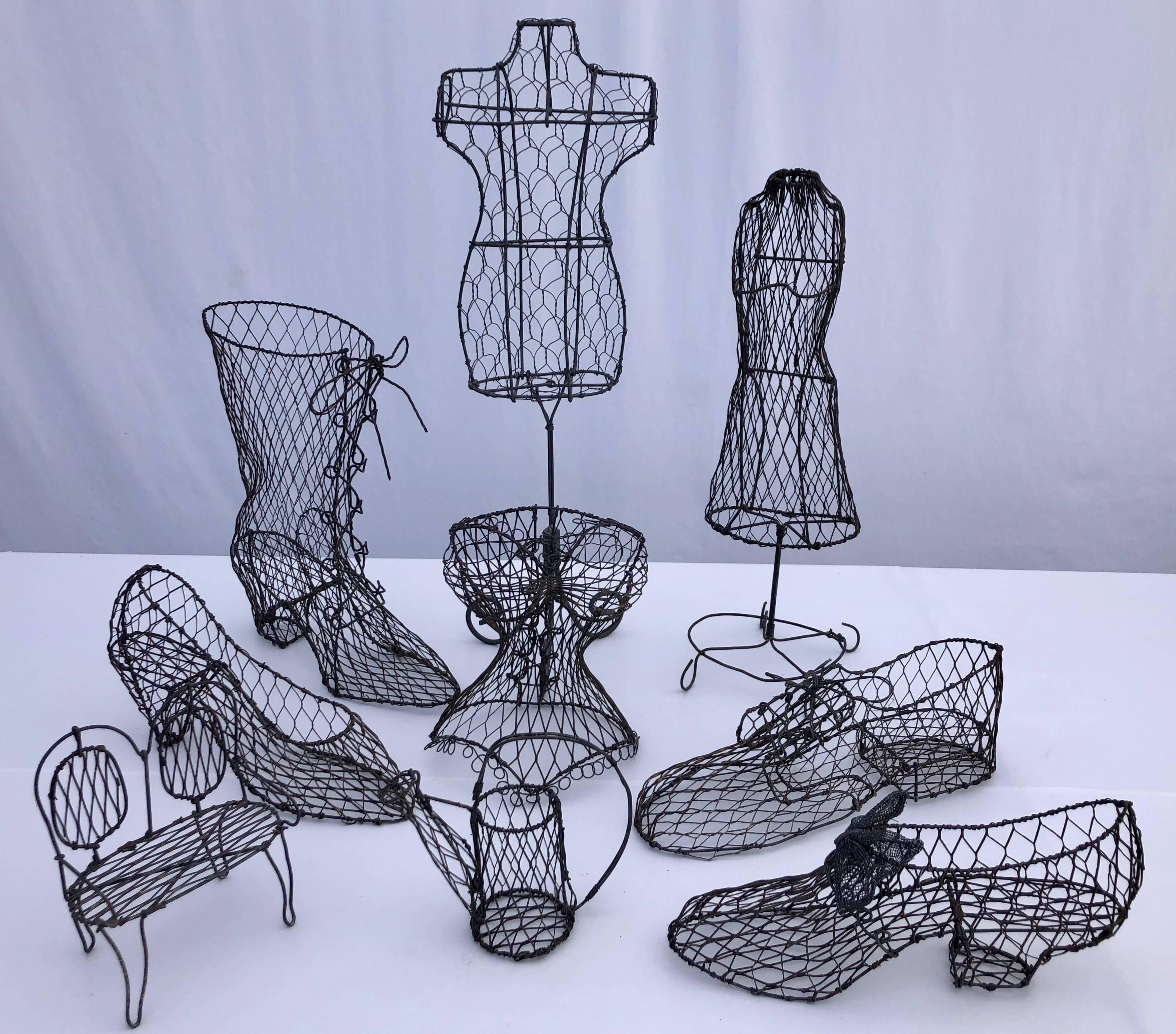 This is a great collection of nine French handmade wire art decorations from the mid-1900s. There are four styles of shoes, two mannequins on stands, a double backed settee, a bodice and a watering can. They have incredible detail, right down to
