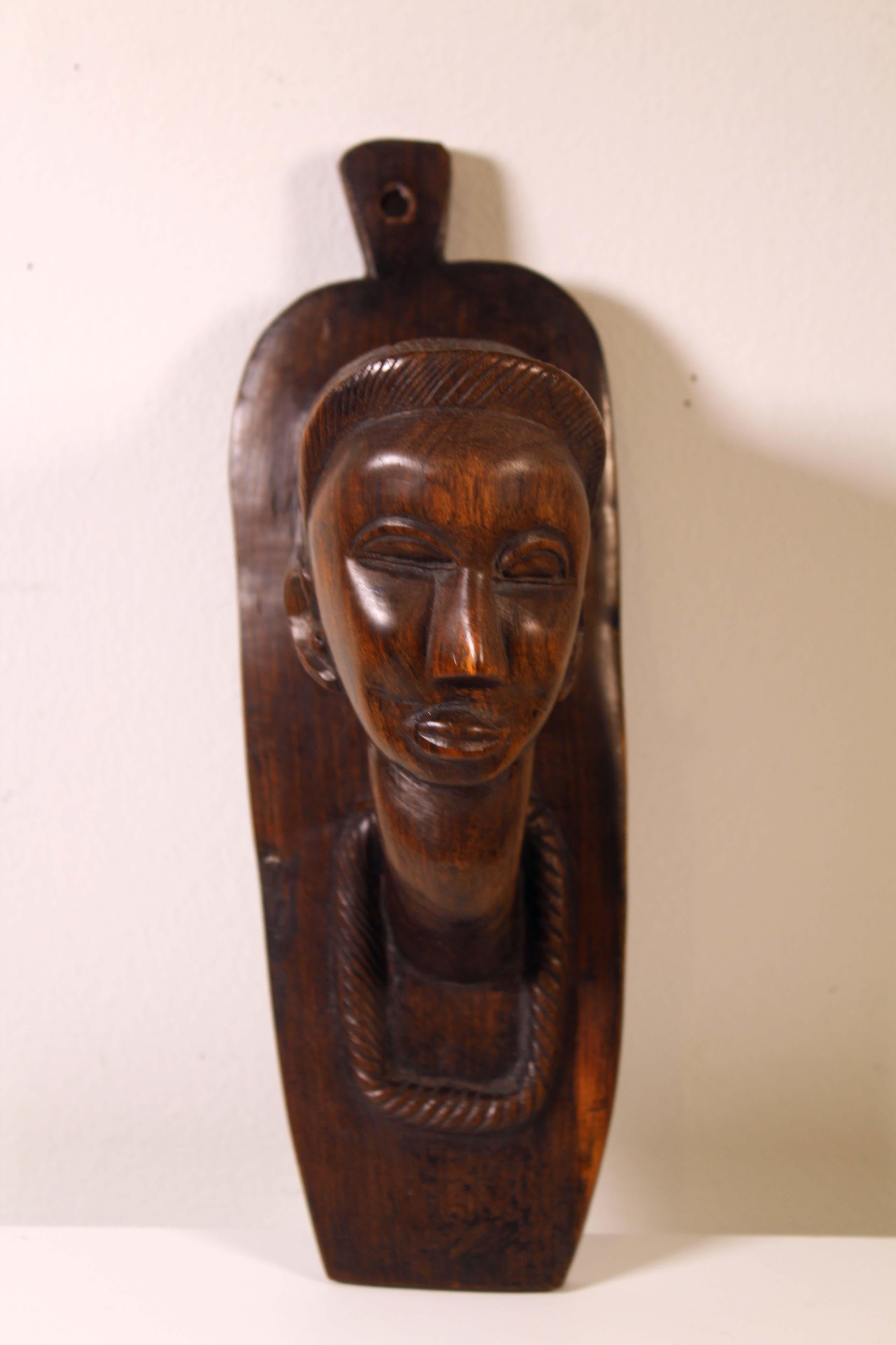 A fascinating set of African wood carvings, including a lidded vessel from Ebony Shona from Malawian. From a private collection. Dimensions: 7”h x 6”dia / 6.5”h x 2.5”w x 1.5”d / 10”h x 3.5”w x 4”d. In very good condition.
 