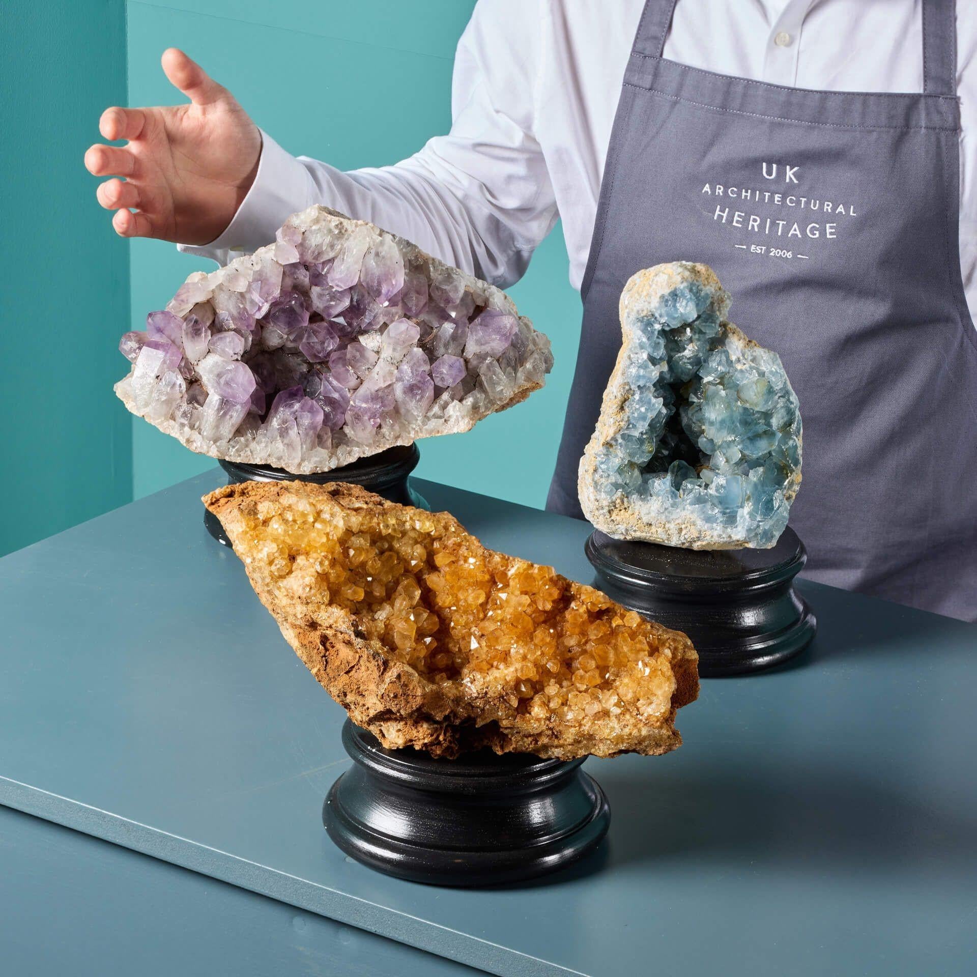 A beautiful collection of three large cabinet mineral specimens including amethyst, blue celestite and limonite quartz presented on our medium painted plaster bases. Together, these specimens form a vibrant collection for display, showcasing