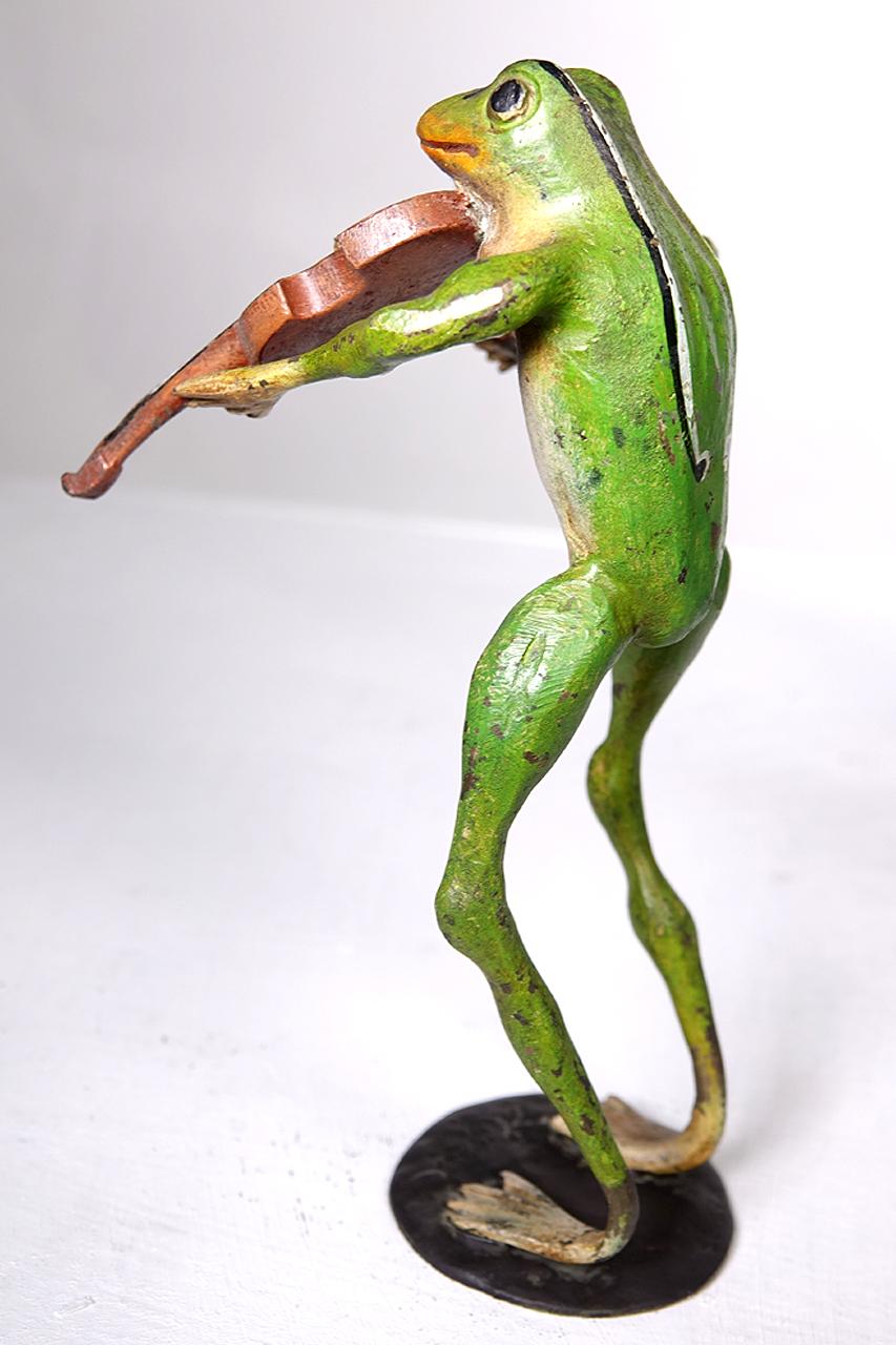 As a child my grandmother had a small collection of these bronze frogs on her piano. It was the first thing my sister and I ran to play with when we were there. This is a nice grouping including a base fiddler, violinist and 3 dancers. They look to