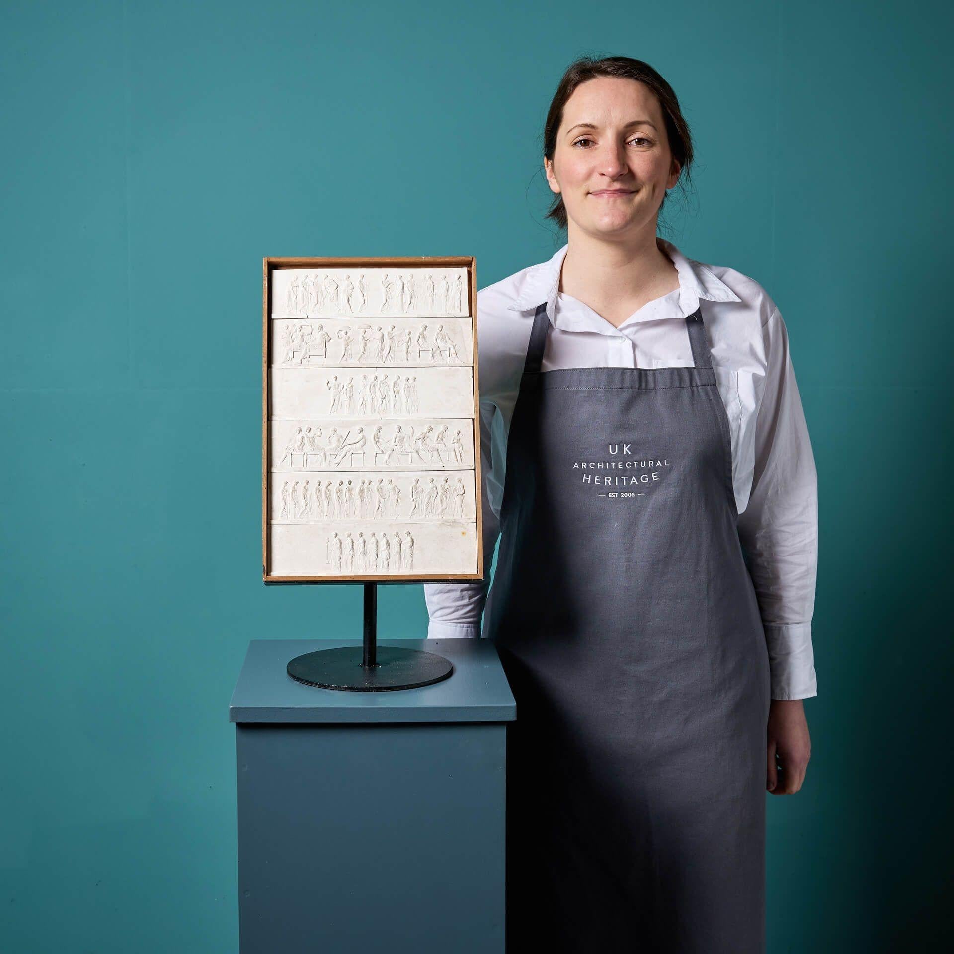 A superb collection of 6 antique plaster models after the ancient 6th century BC Parthenon Frieze. Supplied loose, these mini friezes are presented in a wooden tray and mounted on a bespoke steel stand for display.

The Parthenon Frieze

Believed to