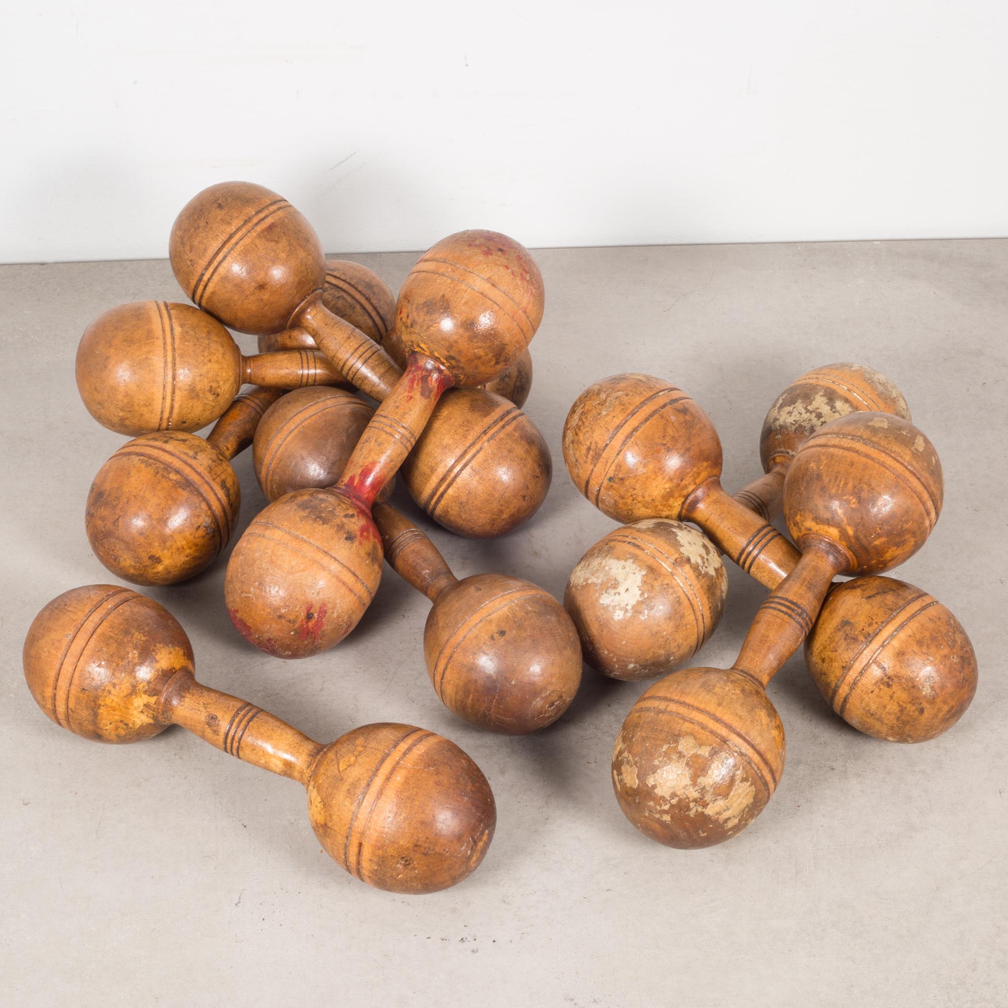 About

A collection of 7 turn of the century solid wooden exercise barbells/dumbbells with carved line detailing. Some have residual paint and one has 