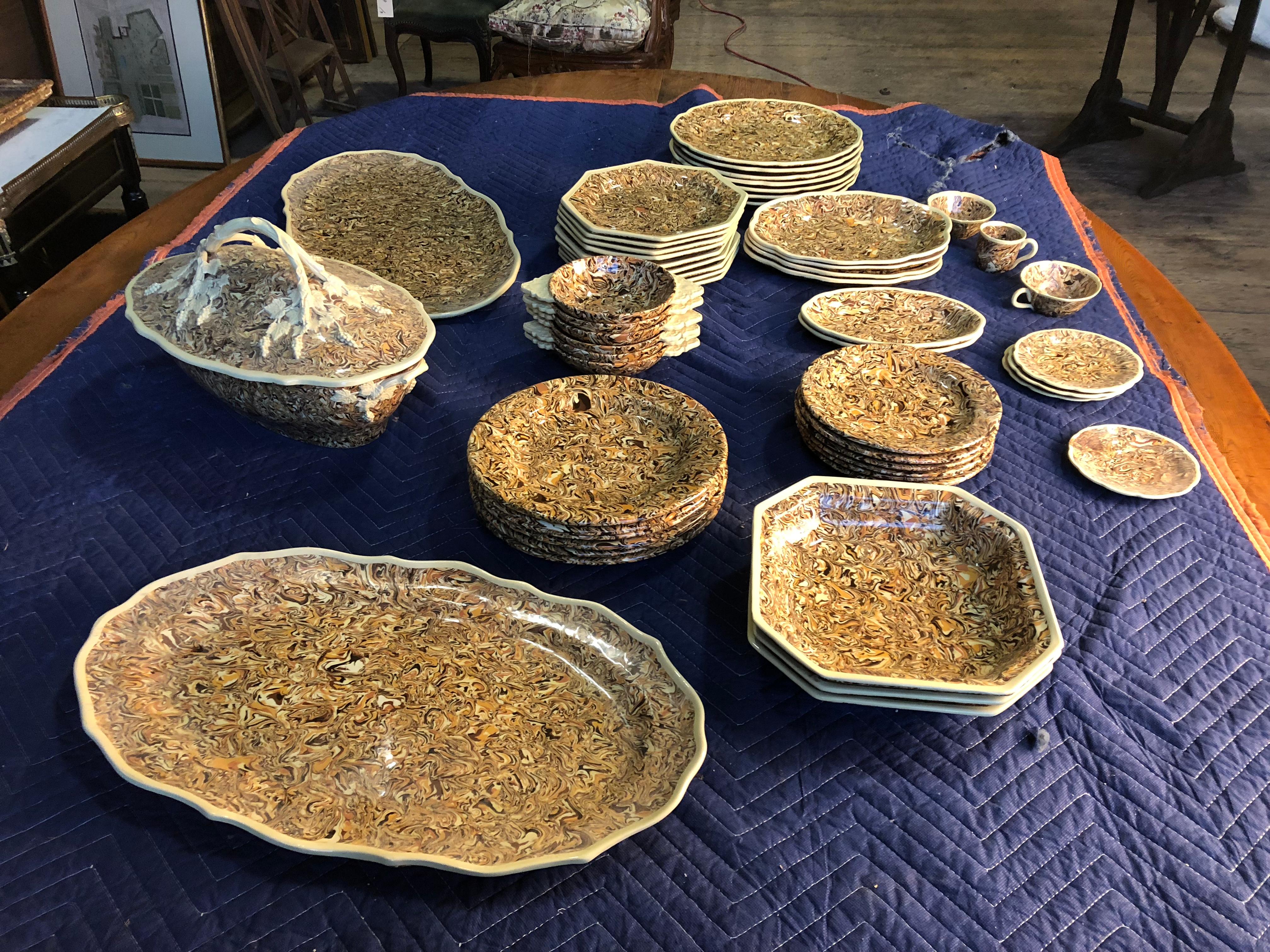 A collection of Apt faience in browns, creams and other earth tones, 53 pieces in total. From the private collection of Pierre Moulin, founder of the Pierre Deux shops.
The patterns in each piece is created by layering and mixing different color