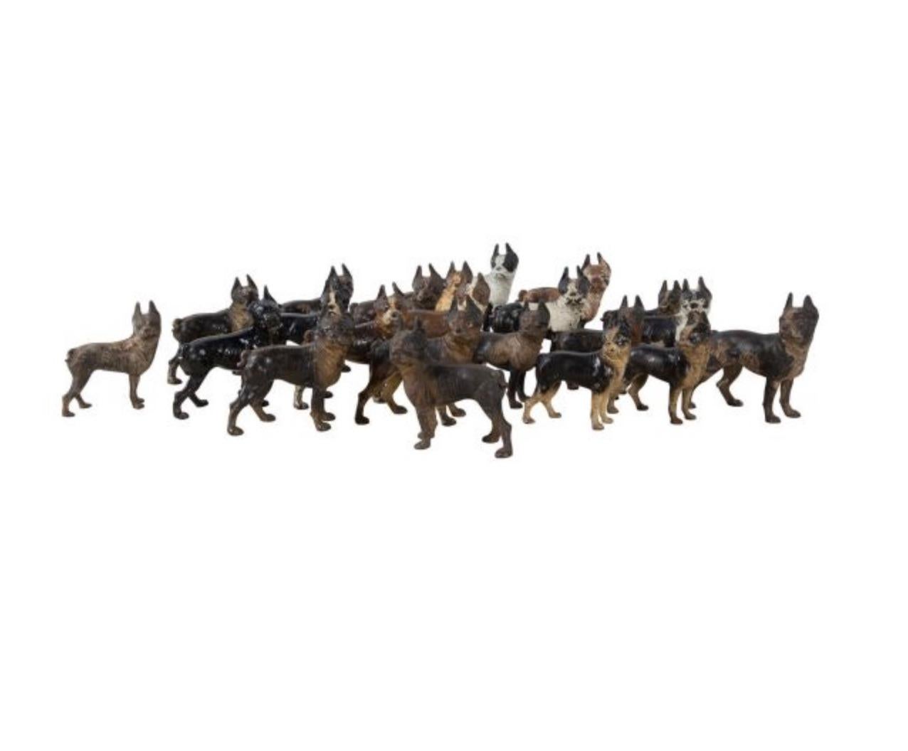 Boston terrier iron door stop collection in original paint circa 1930s. Priced individually.