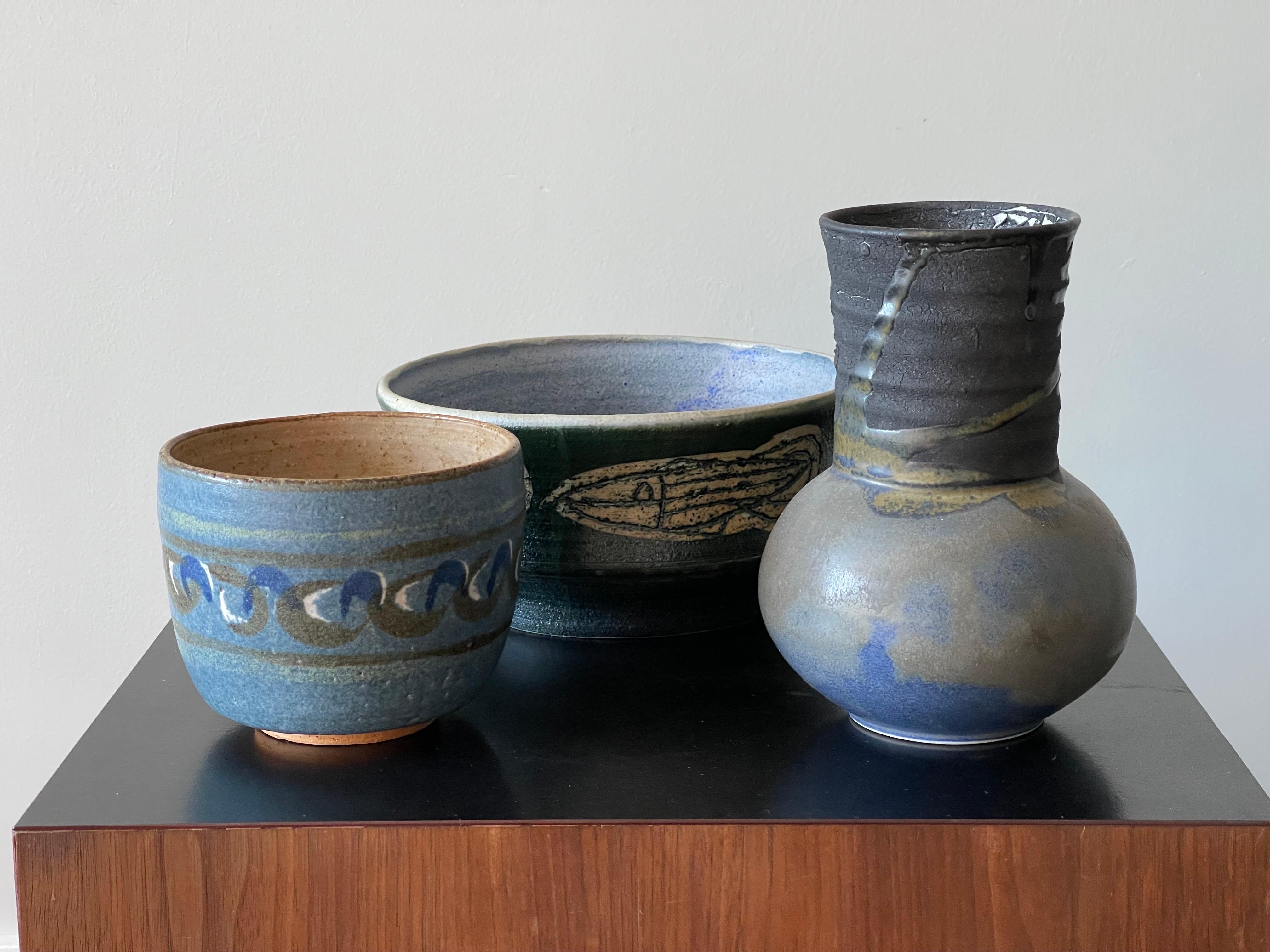 Lovely collection of Mid-Century Modern pottery. Two bowls by listed Regional Florida artists and a Raku vase by a Swedish artist ranging from 1961-1977. The Raku vase shows peeling on the inside but that was done in the firing process and is