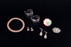 Collection of costume jewellery: rings, earrings, brooch and bracelet.