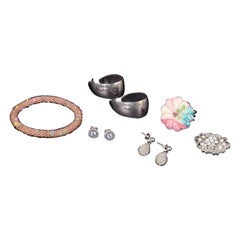 Collection of costume jewellery: rings, earrings, brooch and bracelet.