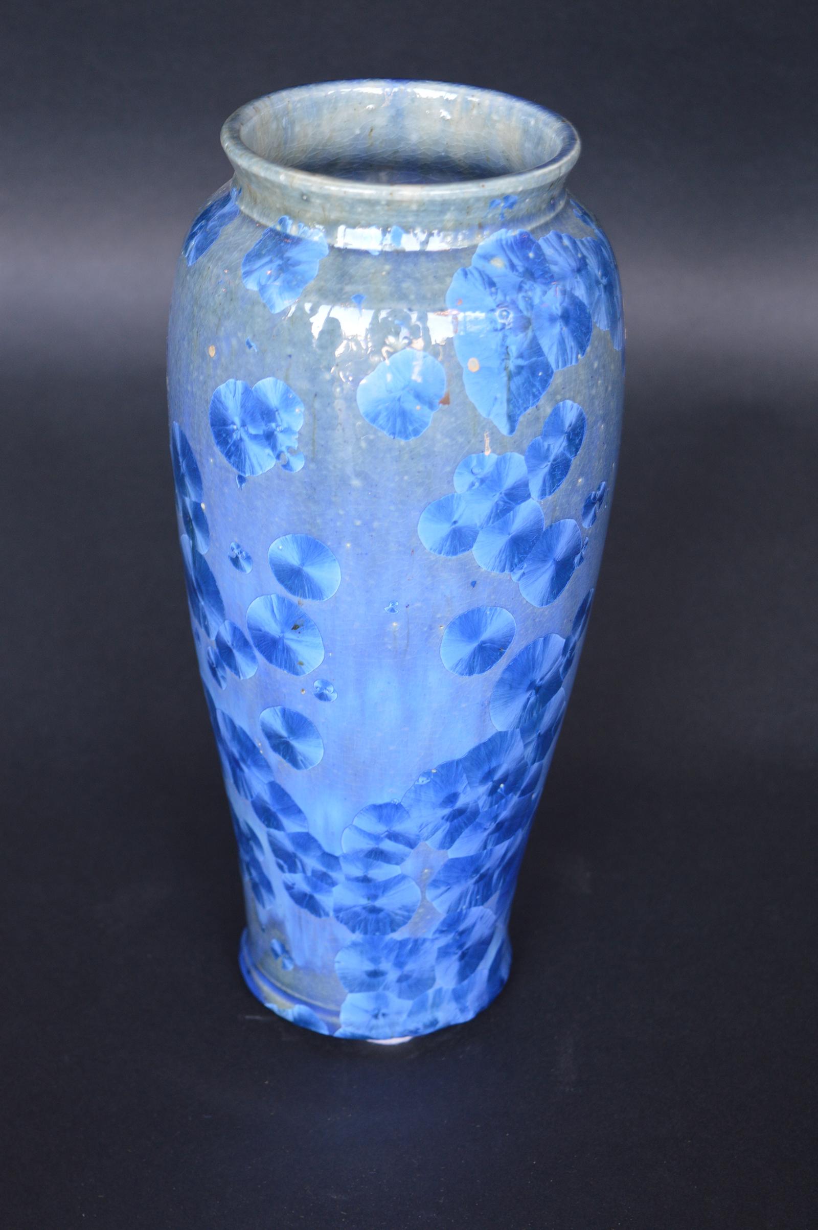 Collection of four ceramic vases. Made by artists based in Monte Rio California. Crystal Glaze is a High zinc and titanium glaze fired to 2300 degrees Farenheit. Then cooled to 2000 degrees and held for 4-6 hours during which crystals of Wilimite